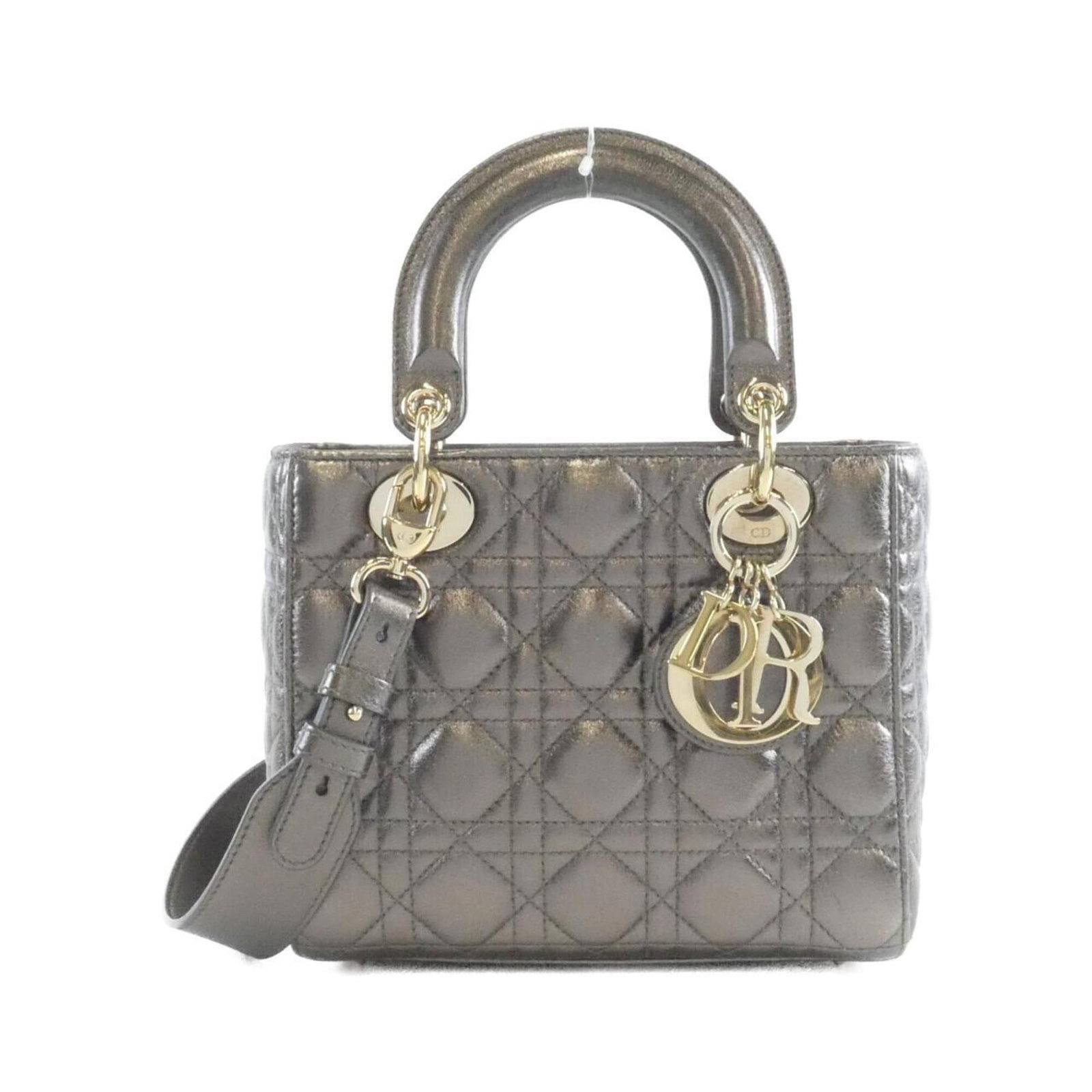 Handbag Christian Dior Leather: Handbag Christian Dior Leather Handbag Christian Dior Leather features a sleek design with metallic gunmetal color and a signature. Made from high-quality leather, the bag measures 17cm x 20cm x 9cm. 