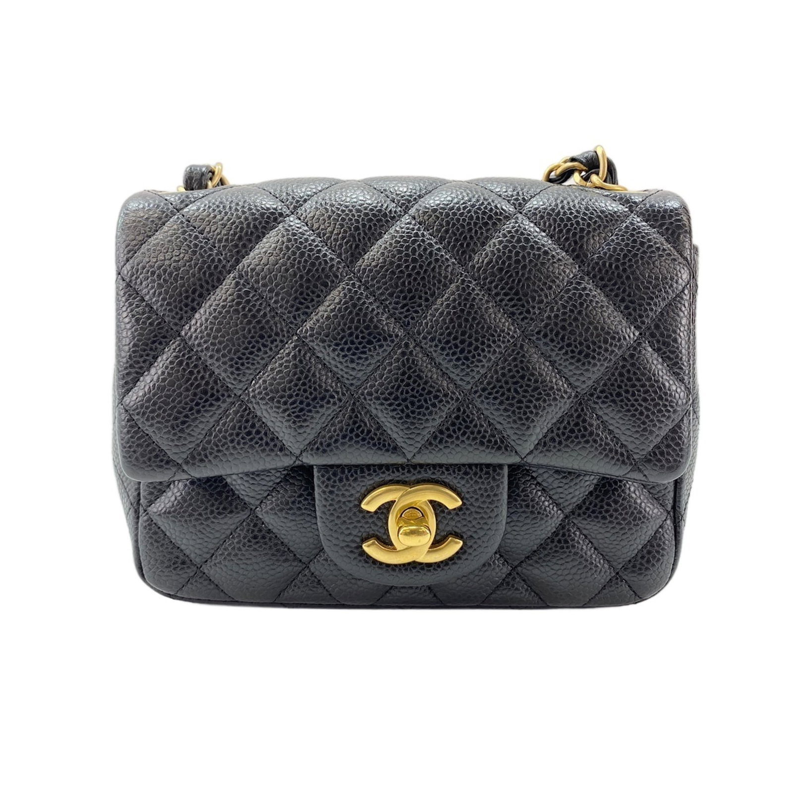 Shoulder Bag by Chanel: Shoulder Bag by Chanel Black shoulder bag by Chanel, measuring 12cm x 17cm x 7cm. This sleek and stylish design from the renowned French fashion house features a classic silhouette with clean lines