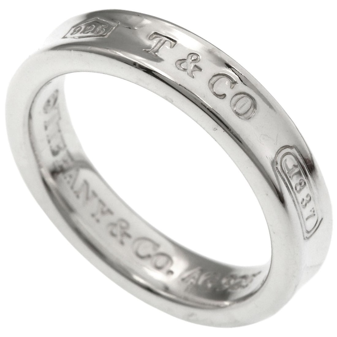 Silver narrow ring from Co Tiffany 1837: Silver narrow ring from Co Tiffany 1837 Silver narrow ring from Tiffany & Co. 1837 features a sleek, silver design with no main stone. This classic style showcases the brand's signature craftsmanship 