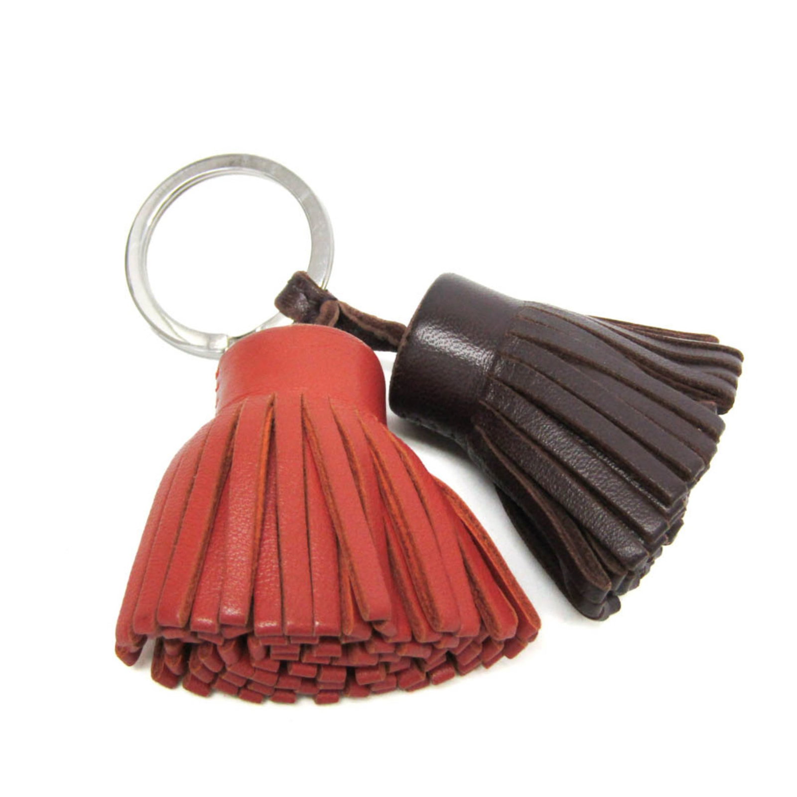 Milo Agneau Keyring Hermes: Milo Agneau Keyring Hermes The Milo Agneau Keyring Hermes boasts a sleek, dark brown design with a subtle sheen. Made from high-quality agneau Milo material, this stylish keyring measures 9.5cm x 6cm 