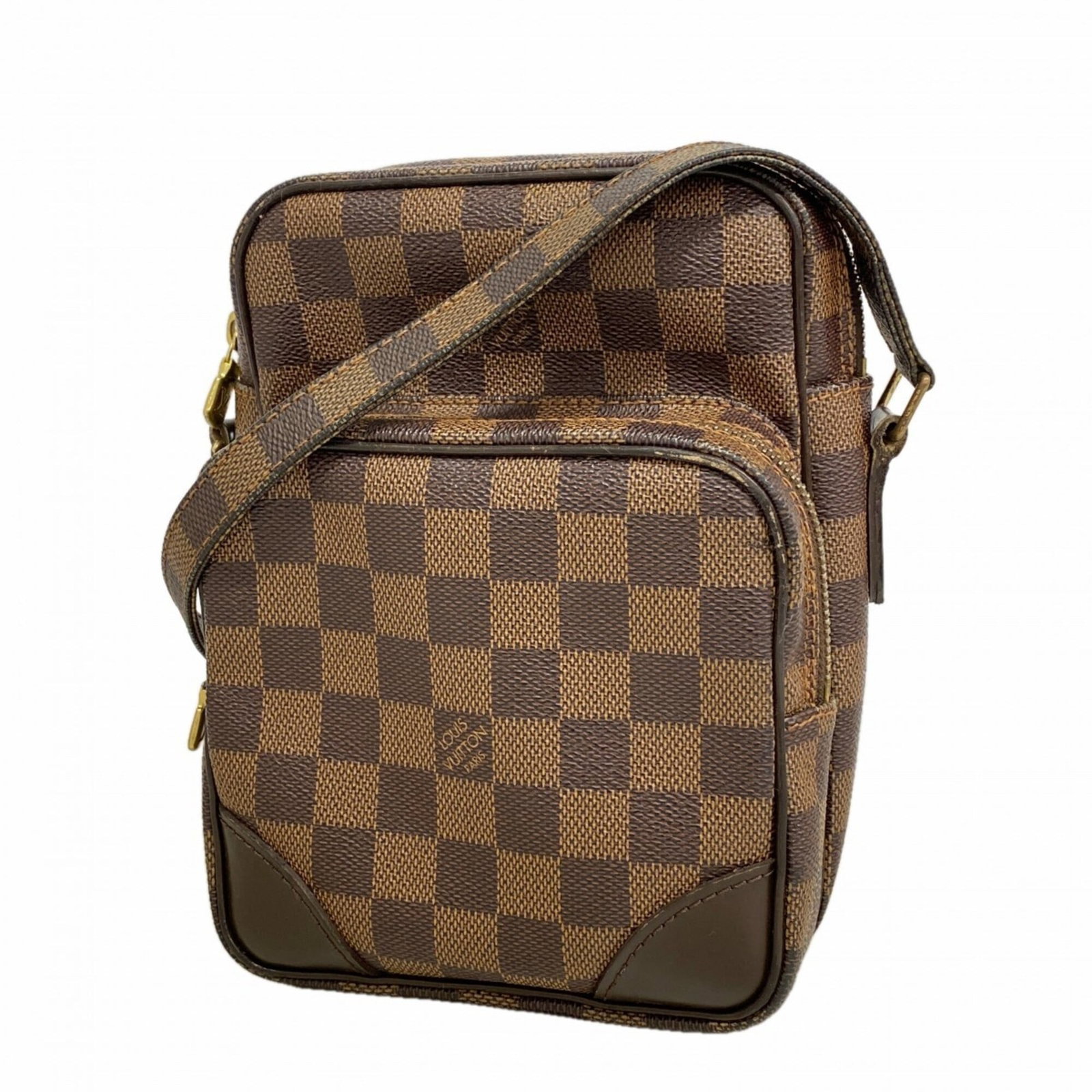 Shoulder bag from Louis Vuitton: Shoulder bag from Louis Vuitton The Louis Vuitton Ebene shoulder bag boasts its signature monogram pattern and sleek design, measuring 21cm x 15cm x 9cm. This stylish accessory features a compact size