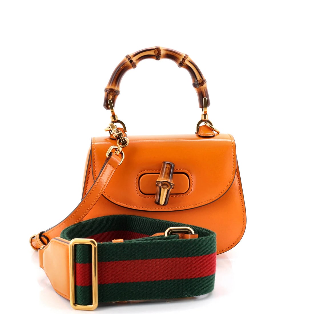 Gucci Bamboo Leather Bag 1947 Mini Top Handle: Gucci Bamboo Leather Bag 1947 Mini Top Handle The Gucci Bamboo Leather Bag 1947 Mini Top Handle boasts a vibrant orange exterior, complemented by neutral canvas interior and aged gold hardware. This s