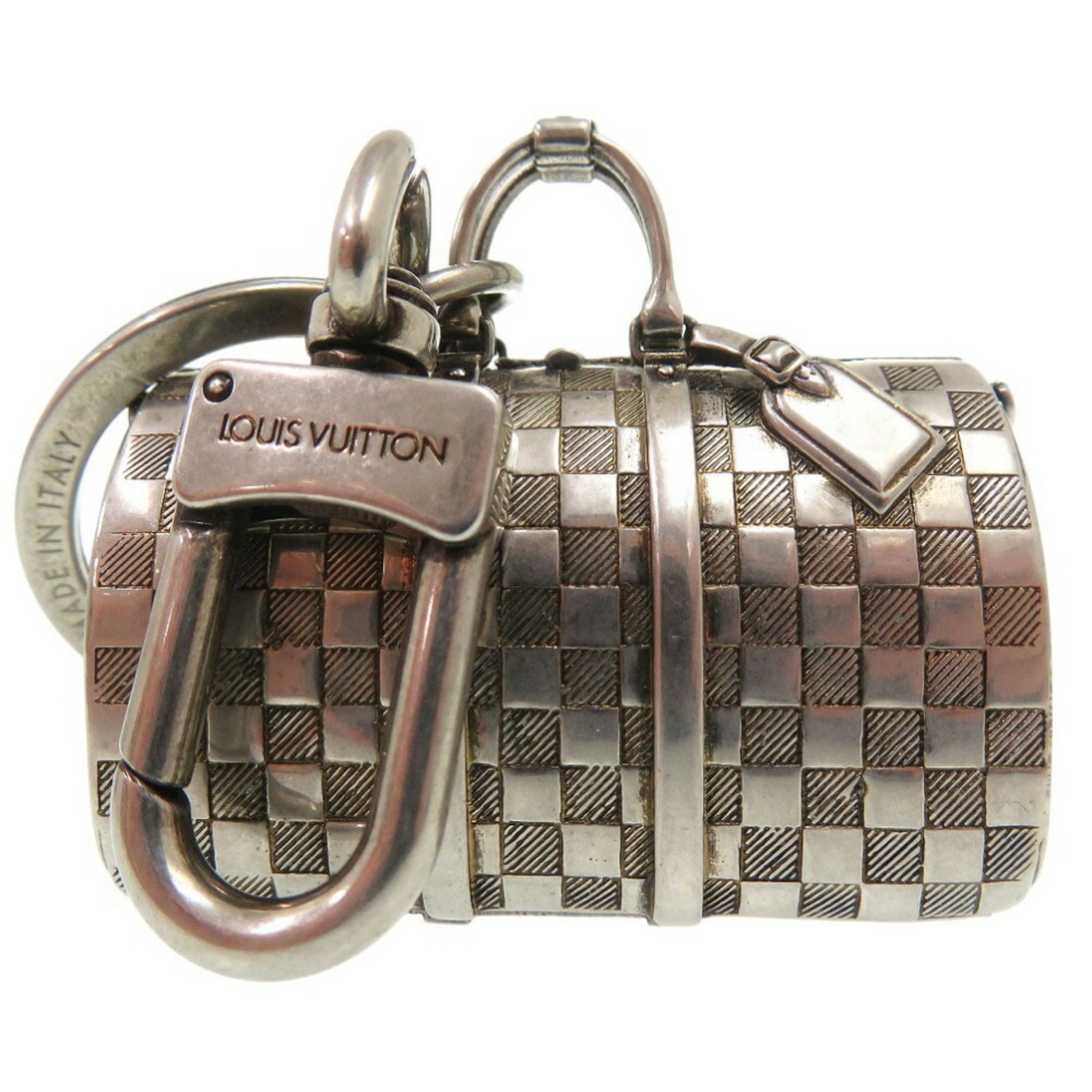 Keyring Metal By Louis Vuitton: Keyring Metal By Louis Vuitton Silver metal keyring by Louis Vuitton, crafted from high-quality metal. This elegant accessory bears the iconic brand's signature style. A stylish addition to any purse 