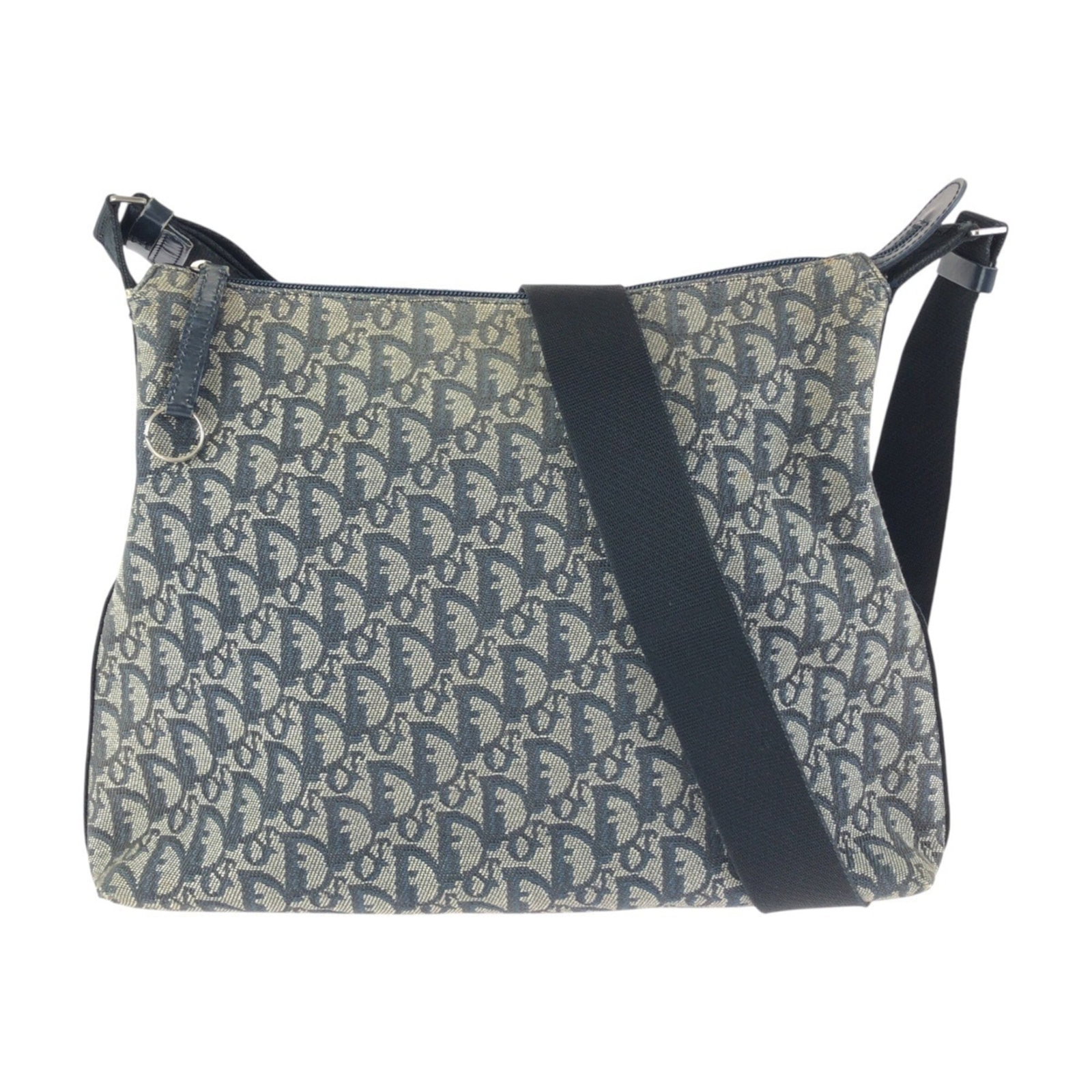 Christian Dior Messenger Canvas Leather Bag: Christian Dior Messenger Canvas Leather Bag Gray and Navy canvas leather bag from Christian Dior, featuring a messenger design. The bag's canvas material provides a sturdy base while the leather accen