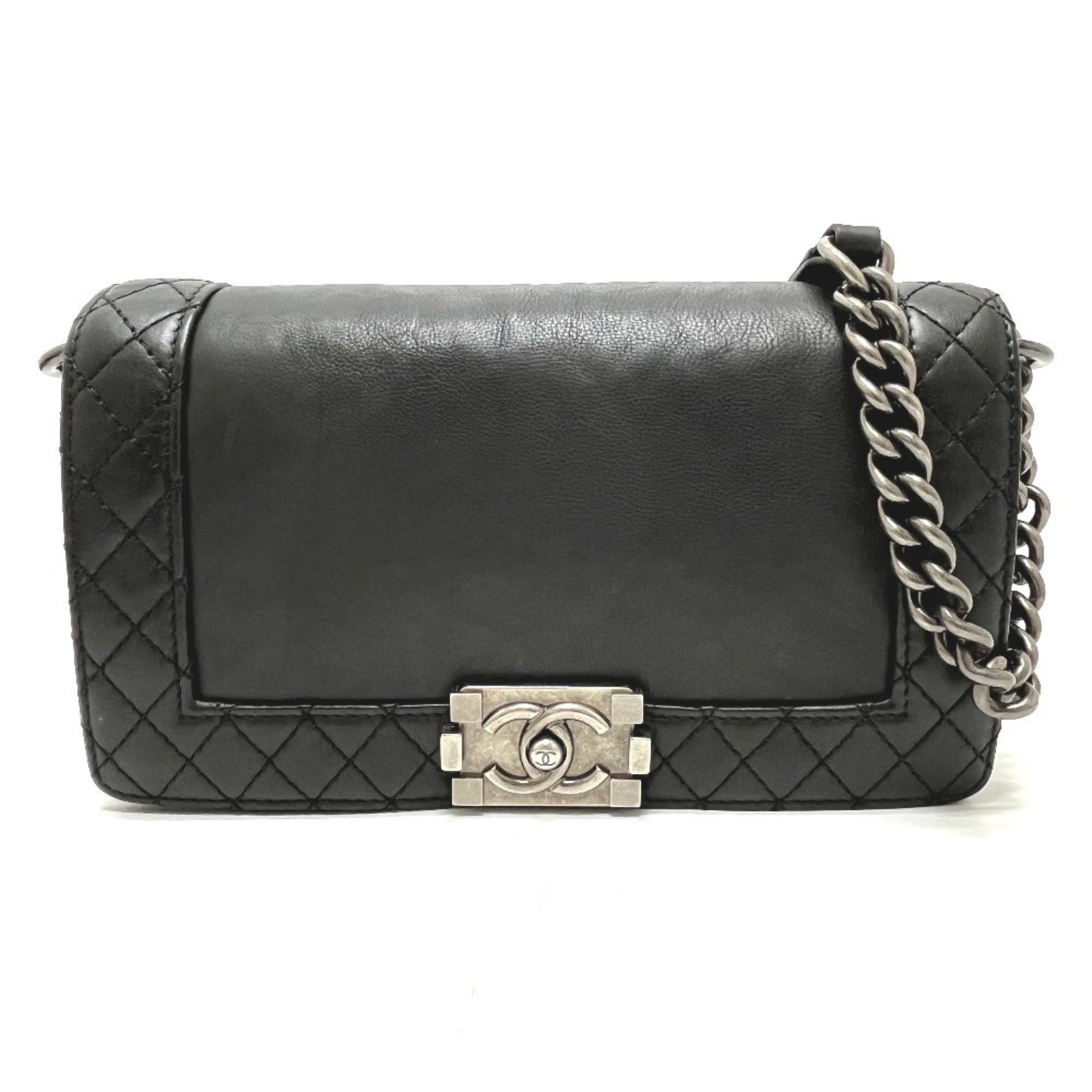 Shoulder Bag Leather Chanel: Shoulder Bag Leather Chanel Black leather shoulder bag from the Boy Chanel line, featuring a classic design with a push lock closure and adjustable strap length. Made from high-quality calfskin leathe