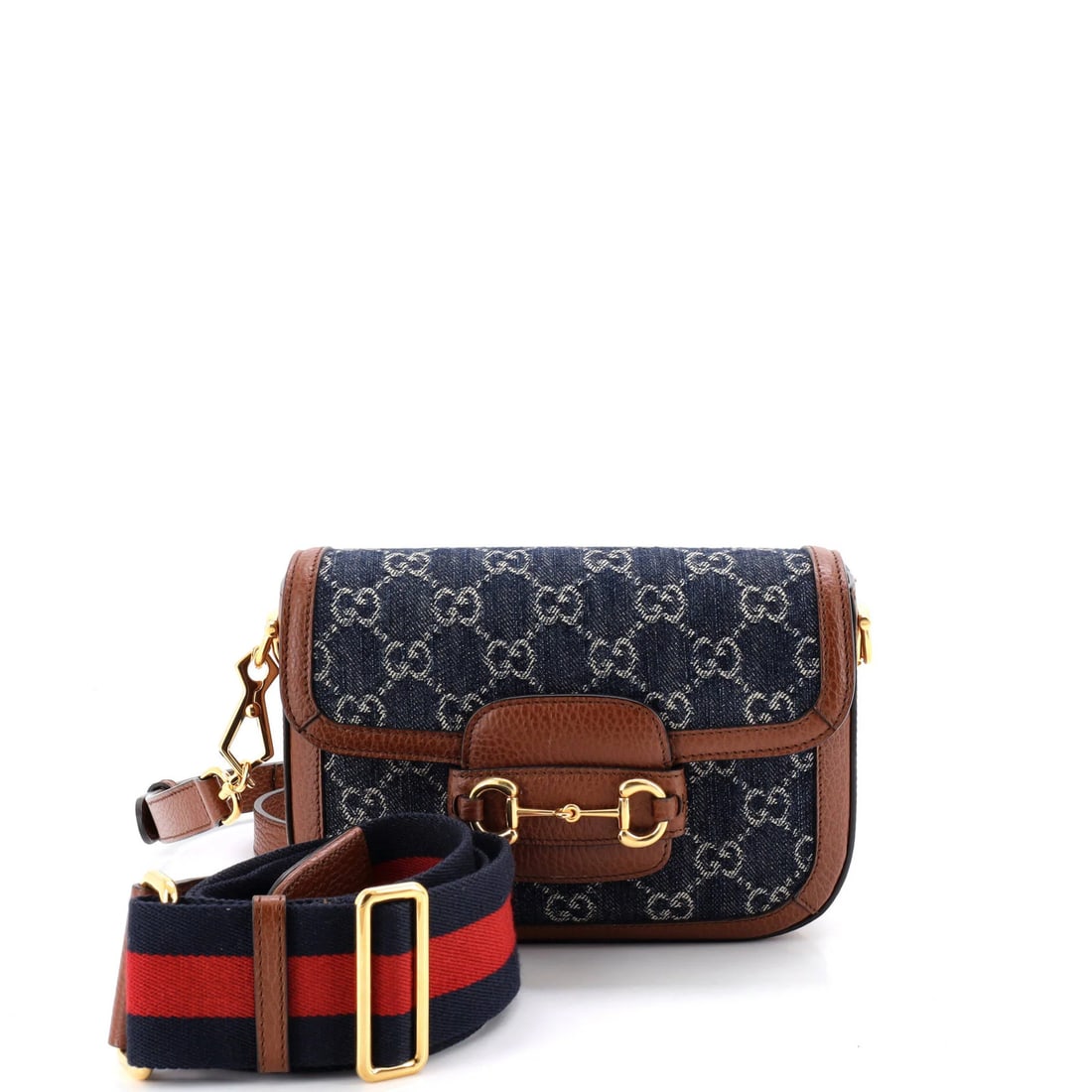 Gucci Horsebit 1955 Shoulder Bag GG Denim Mini: Gucci Horsebit 1955 Shoulder Bag GG Denim Mini Gucci Horsebit 1955 Shoulder Bag GG Denim Mini features a classic design with a denim exterior in blue, complemented by neutral interior and gold