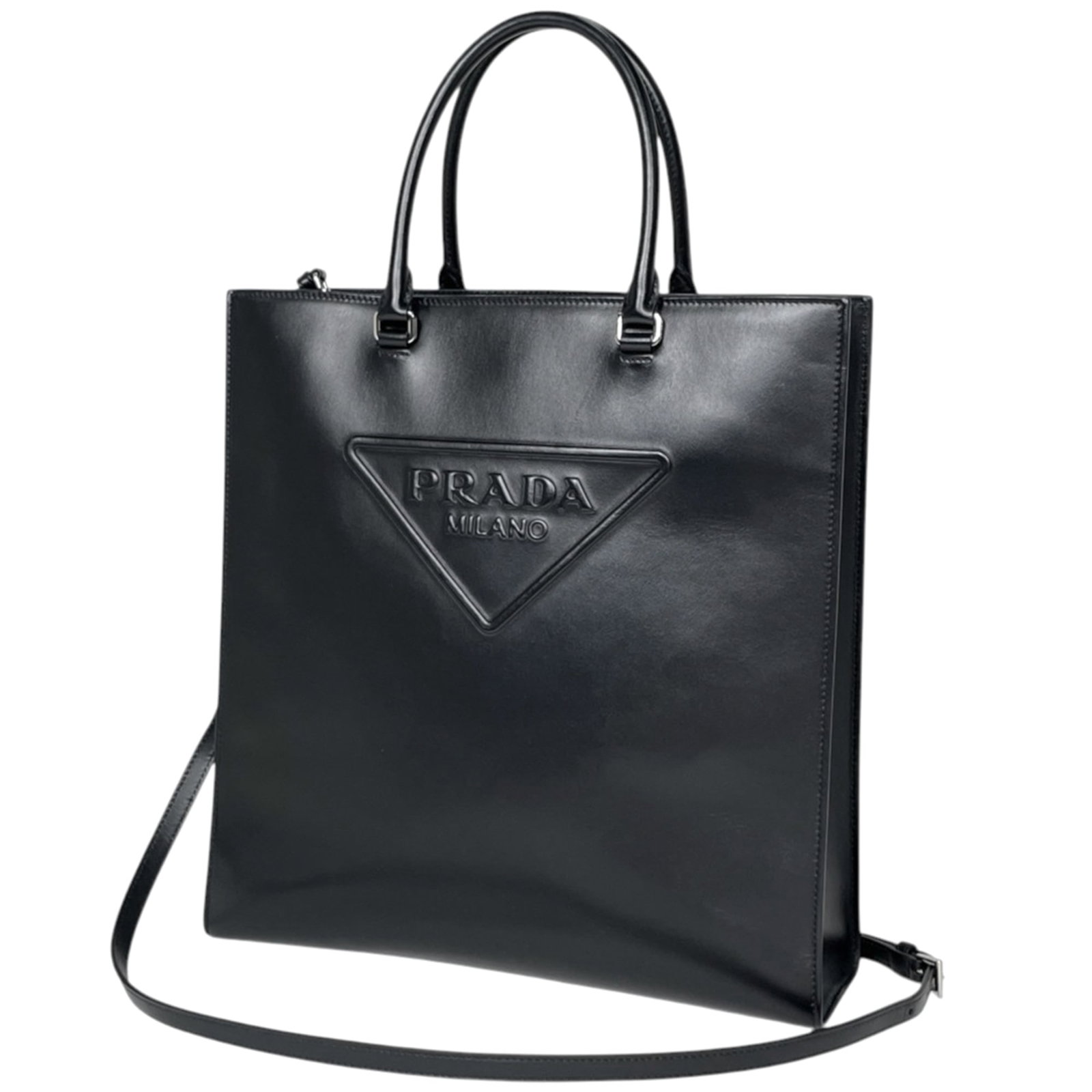 Tote bag leather: Tote bag leather Black leather tote bag with dimensions 33cm x 31.5cm x 10cm, bearing a signature. Made from high-quality leather, this stylish bag features a sleek design and classic style. Perfect