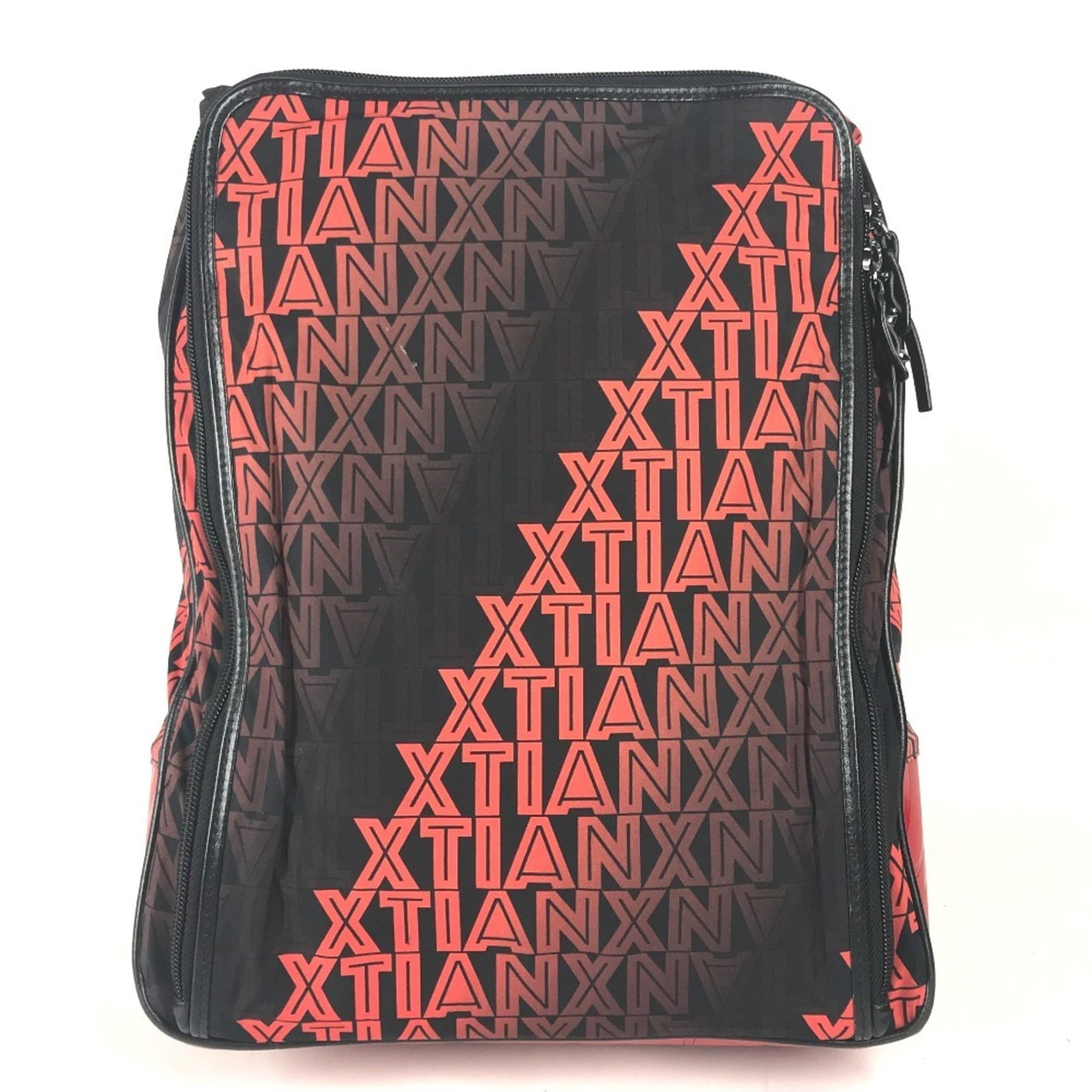 Christian Louboutin Leather Nylon Backpack: Christian Louboutin Leather Nylon Backpack Christian Louboutin's sleek leather nylon backpack boasts a striking black and red color combination, making it a stylish accessory for everyday use. With