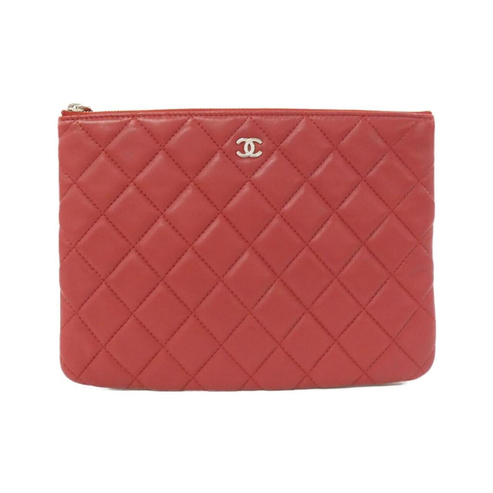 Leather Pouch by Chanel: Leather Pouch by Chanel Red lamb leather pouch from Chanel, measuring 17cm x 23cm. This stylish pouch features high-quality leather construction and a classic design that exudes timeless elegance. Its