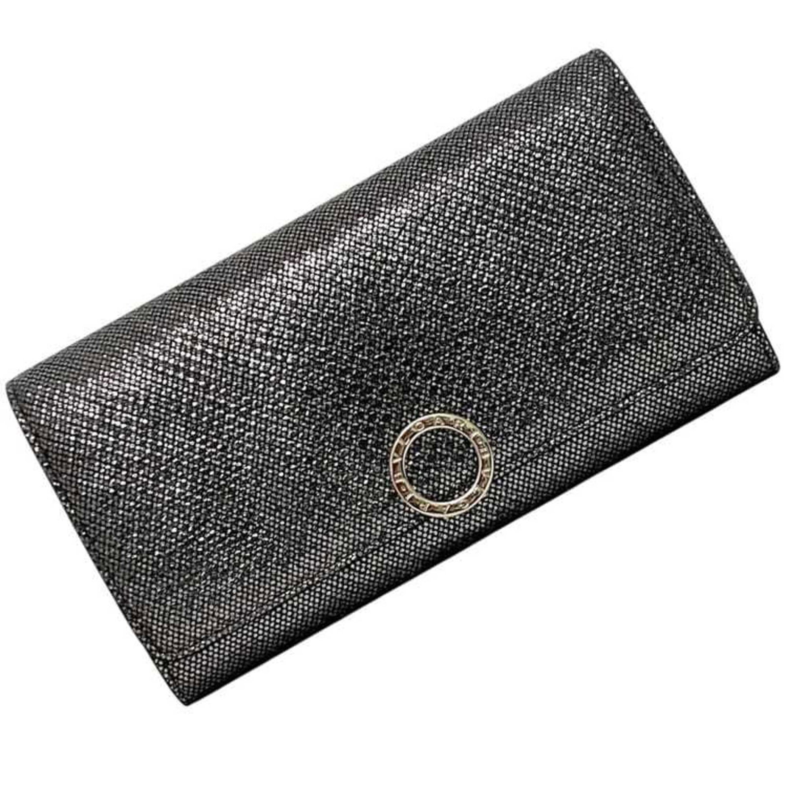 Long Bi fold Wallet Leather: Long Bi fold Wallet Leather The Bvlgari Long Bi-fold Wallet Leather features sleek silver hardware and premium leather construction, making it a stylish accessory for everyday use. Its spacious interi