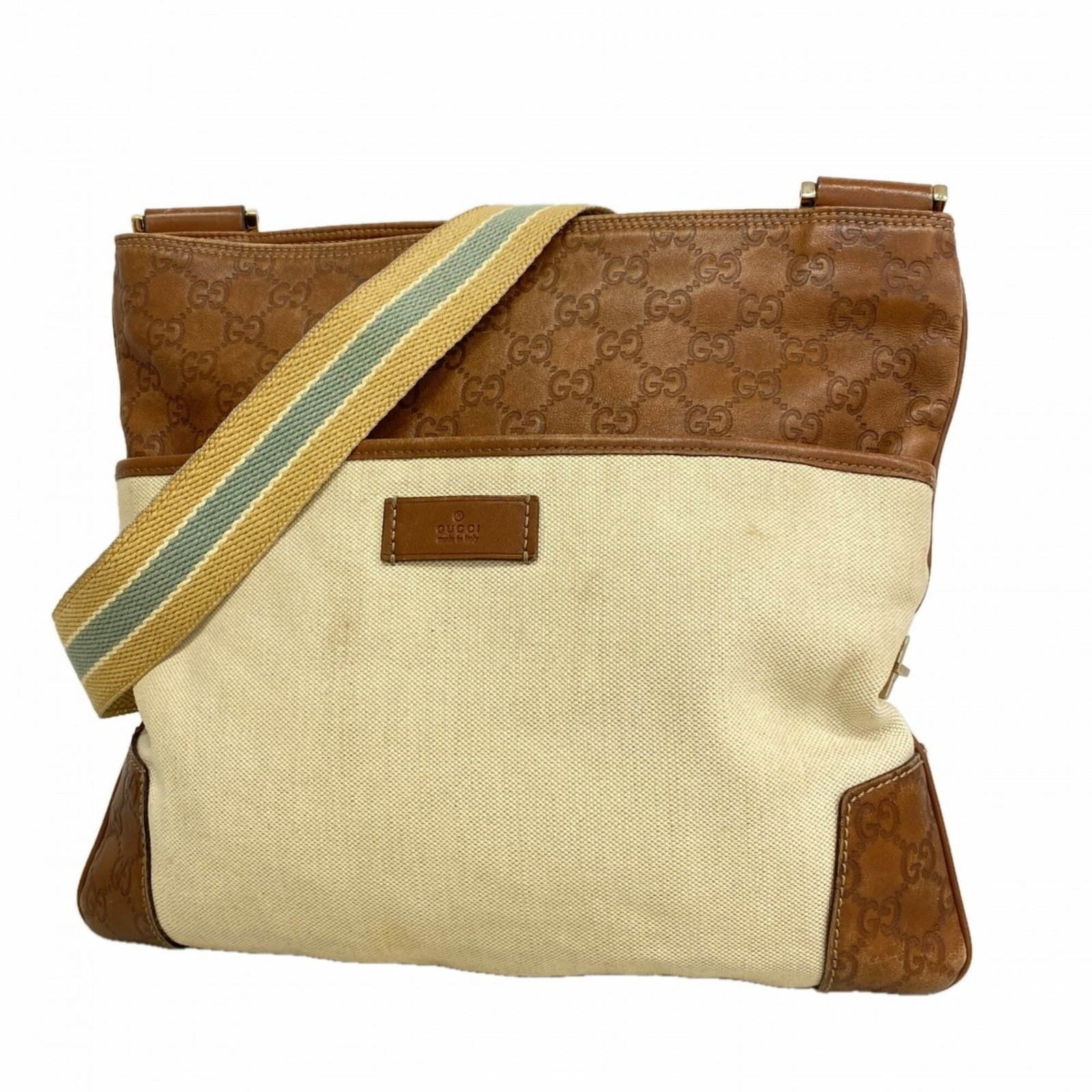 Canvas leather bag Gucci shoulder: Canvas leather bag Gucci shoulder Canvas leather bag with champagne gold hardware in beige and brown tones, featuring a signature. This Gucci shoulder bag measures 30cm x 34cm x 1.5cm and has a