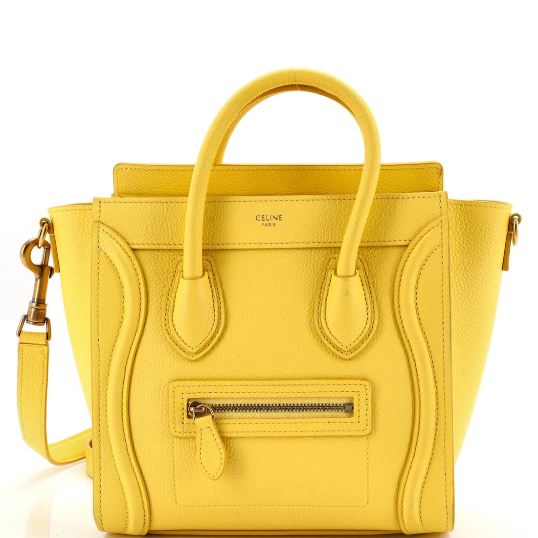 Luggage bag in grainy leather nano: Luggage bag in grainy leather nano Yellow grainy leather nano cross body bag with gold hardware, featuring suede interior and minor scuffs on exterior. Measuring 8" x 4" x 3", it has a 19" strap drop