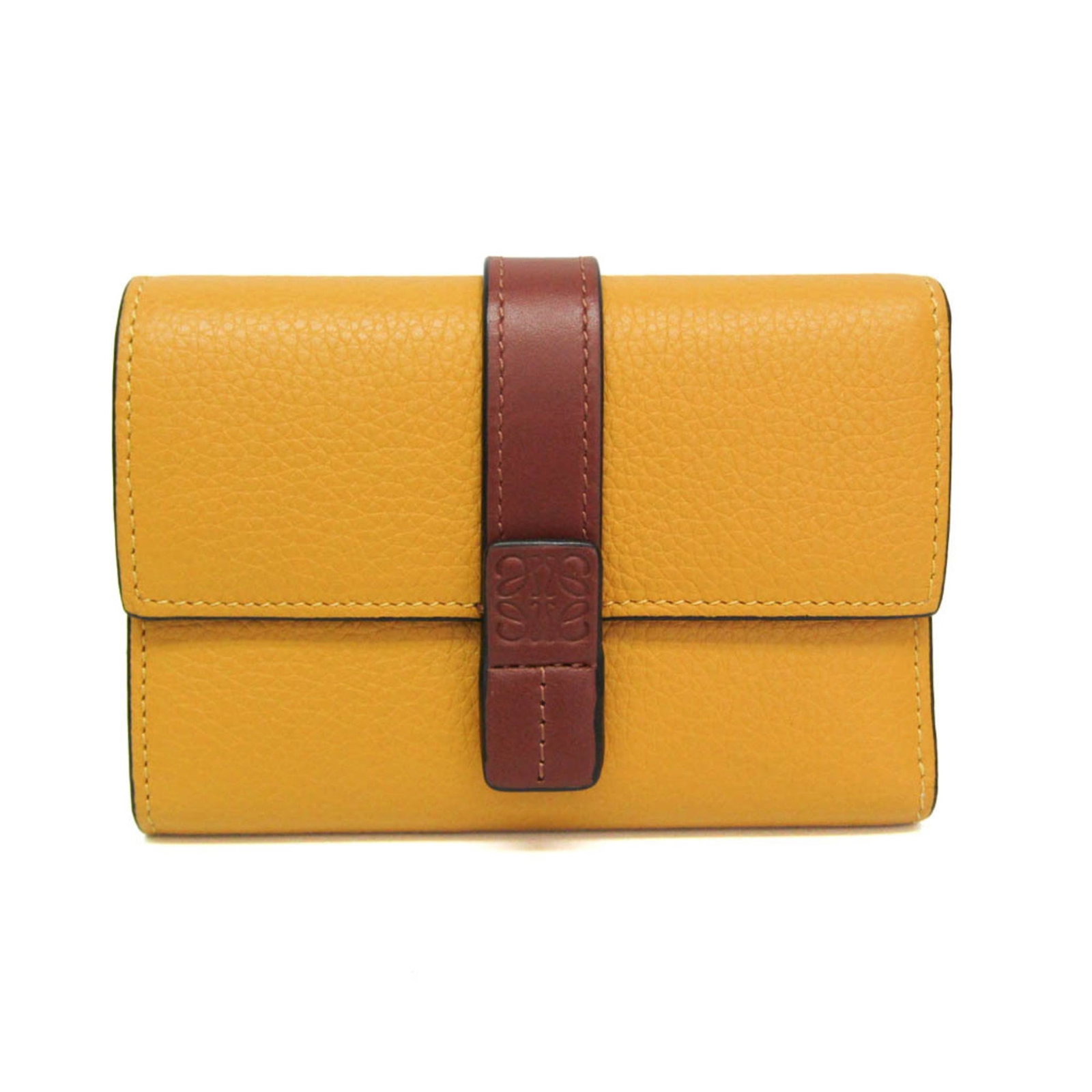 Loewe Wallet (Tri-Fold) Leather: Loewe Wallet (Tri-Fold) Leather The Loewe Trifold Wallet in Brown Leather features a classic tri-fold design with a snap fastener closure, bill slot, and card slots. A coin purse on the outer pocket a