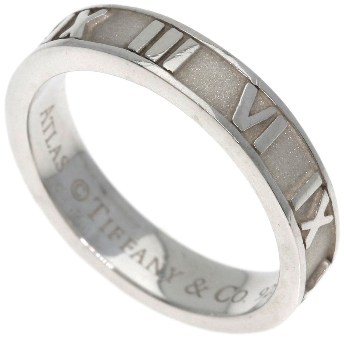 Atlas Silver Narrow Ring Tiffany&Co.: Atlas Silver Narrow Ring Tiffany&Co. Silver ring from Tiffany&Co. with a narrow design, bearing the brand's signature. This piece features a silver metal construction and no main stone. The ring size