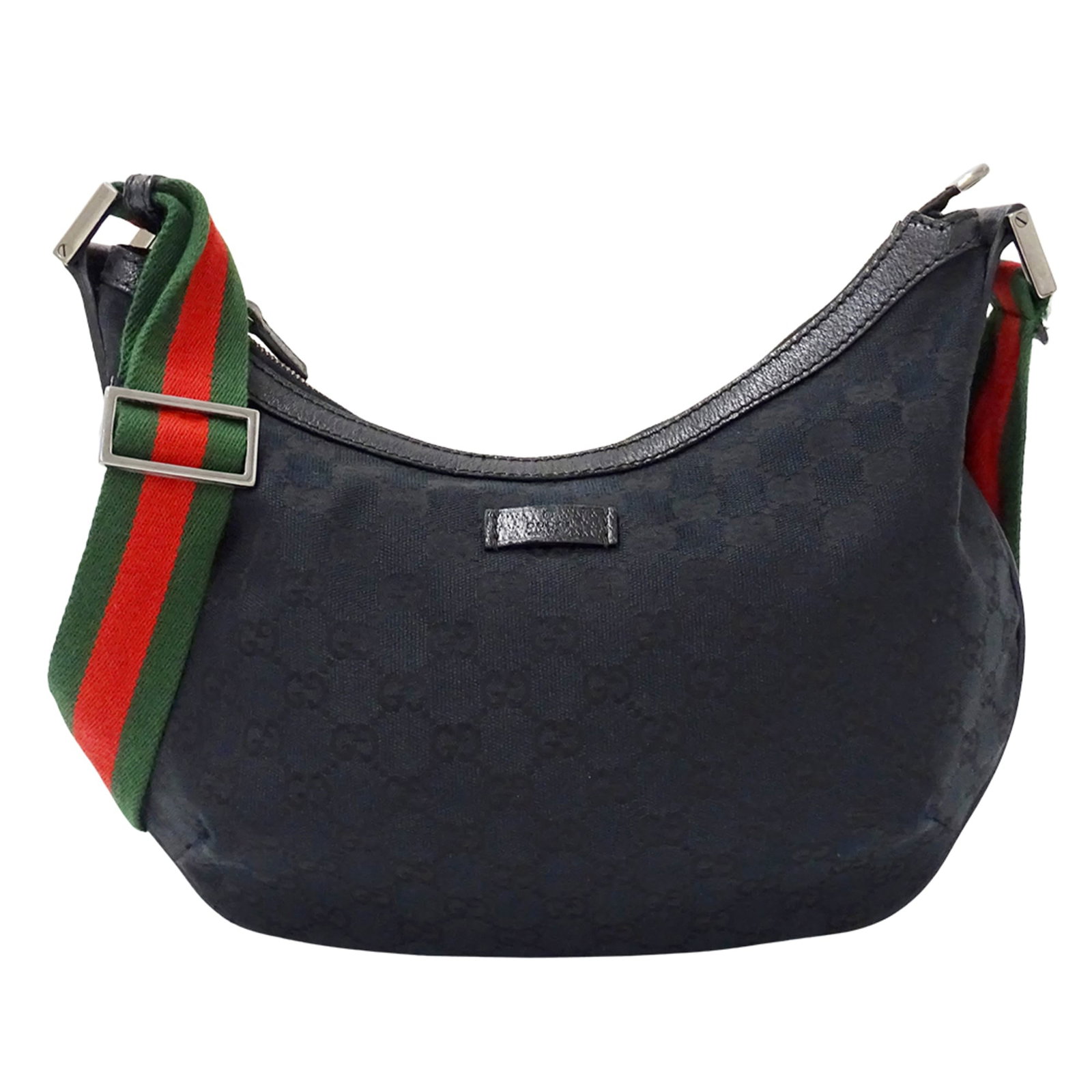 Gucci Handbag Shoulder Bag Gg Canvas: Gucci Handbag Shoulder Bag Gg Canvas Gucci's GG canvas shoulder bag features a sleek black design, perfect for adding a touch of luxury to any outfit. With its compact size and durable material, this 