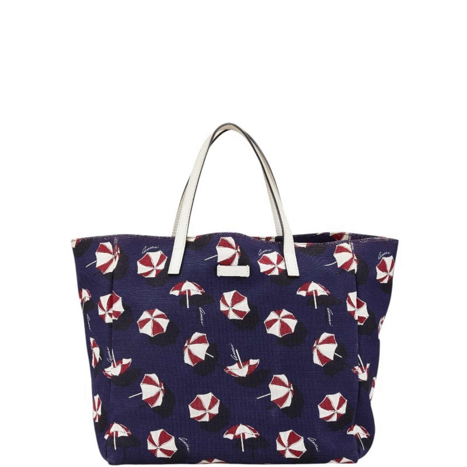 Canvas leather handbag tote gucci: Canvas leather handbag tote gucci Canvas leather Gucci tote bag features an open inner pocket and zipper pocket, offering practical storage options. The multi-color, navy canvas and leather design