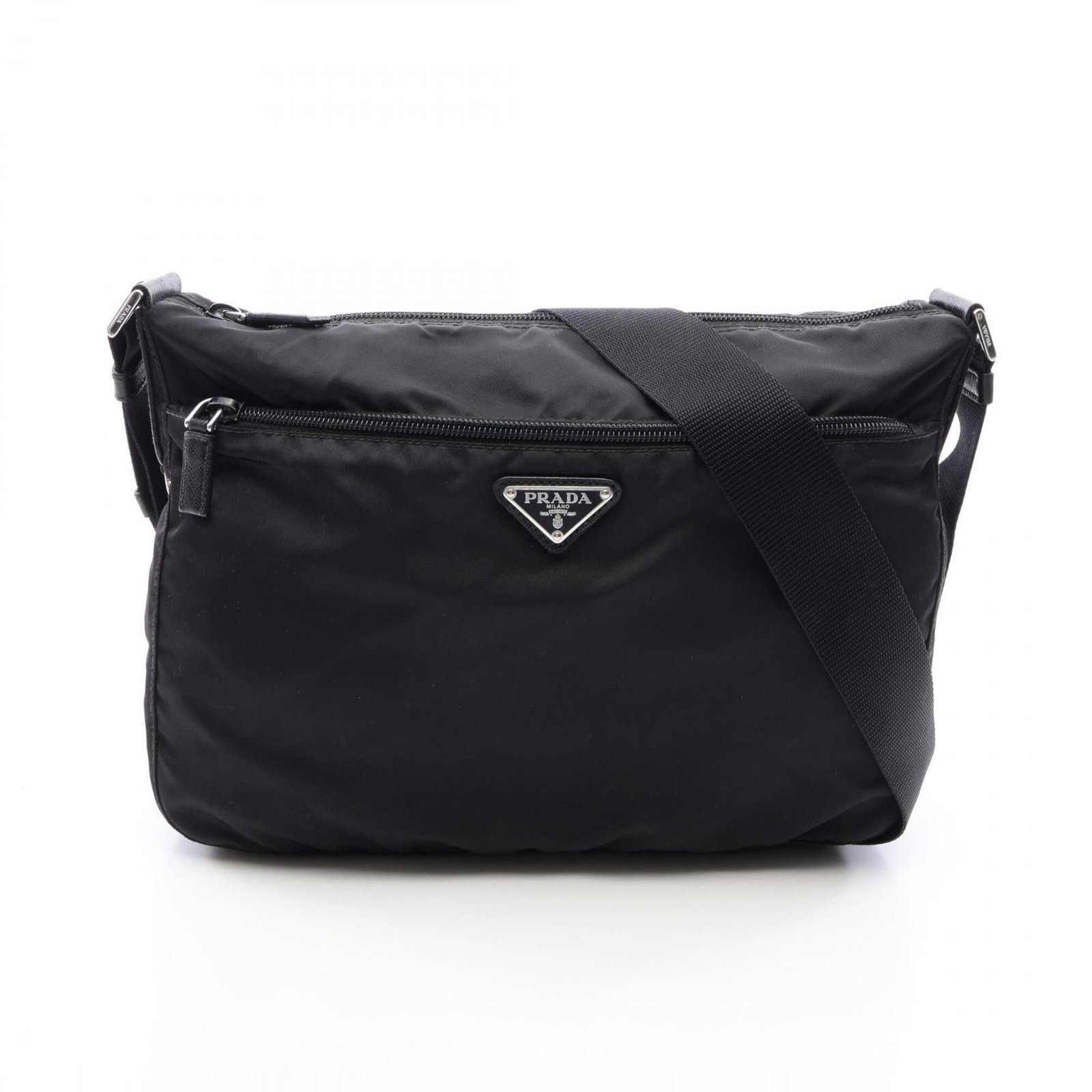 Nylon leather shoulder handbag by Prada: Nylon leather shoulder handbag by Prada Saffiano leather construction and nylon accents give this Prada shoulder handbag its distinctive look. Measuring 24cm x 30cm x 8.5cm, it features adjustable