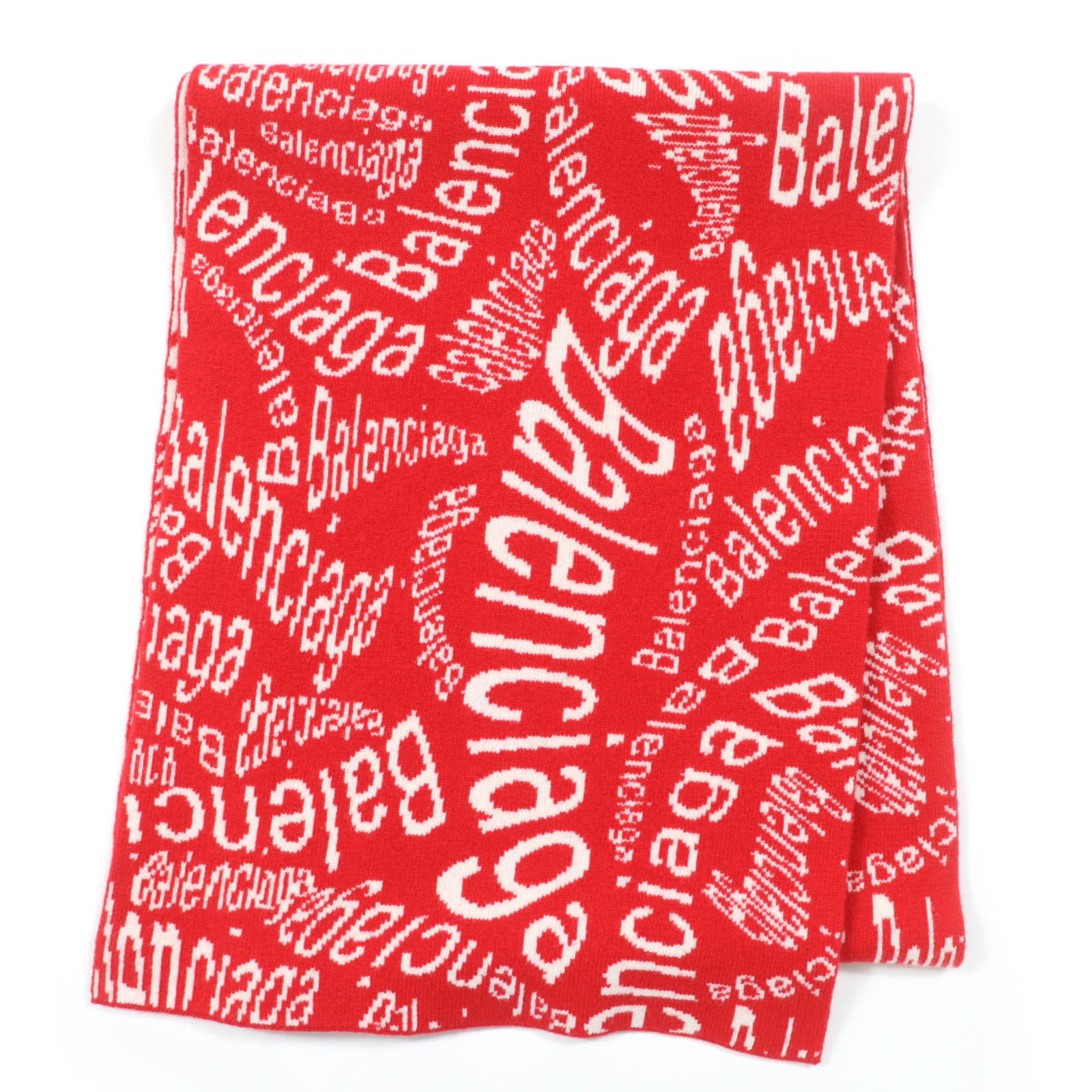 Balenciaga Shawl Wool 99% Nylon 1%: Balenciaga Shawl Wool 99% Nylon 1% Balenciaga's shawl features a striking ivory and red color combination, showcasing the brand's signature style. Made from a blend of wool (99%) and nylon (1%), this