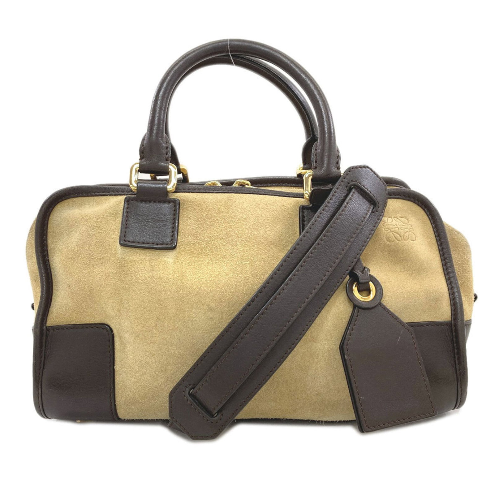 Handbag suede by Loewe: Handbag suede by Loewe Suede handbag by Loewe, featuring the iconic brand's signature style. Made from high-quality suede, this brown bag measures 17cm x 29cm x 10cm and offers a sleek, sophisticated