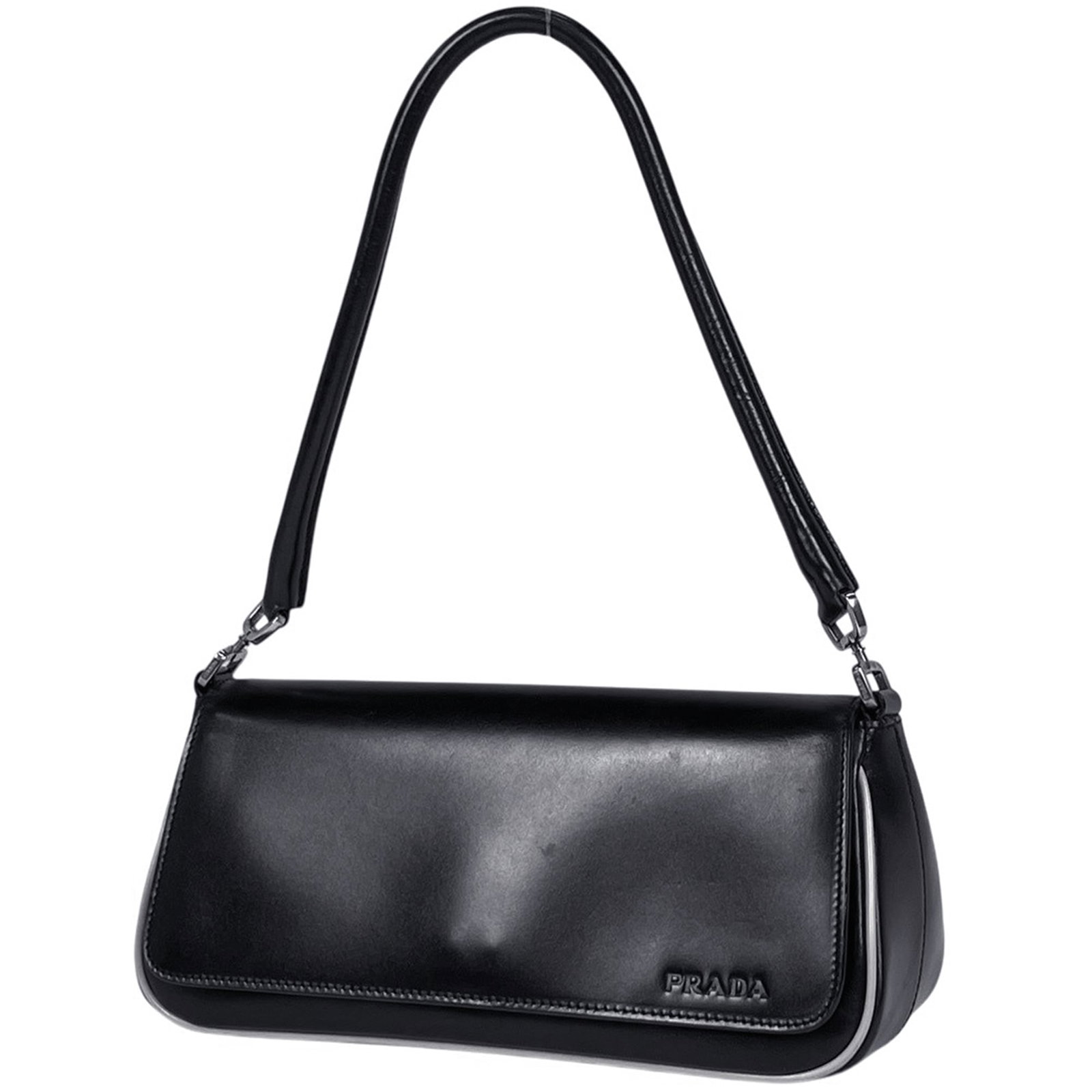 Handbag leather by Prada: Handbag leather by Prada Prada's sleek black leather handbag boasts a compact size, measuring just 10cm x 24cm x 9cm. The bag's material and color provide a sophisticated look, while its dimensions