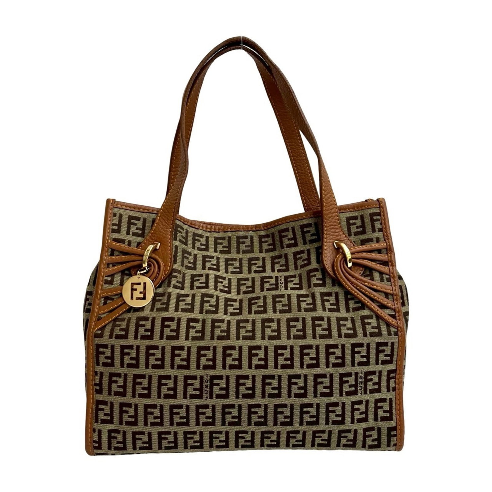Canvas leather bag tote by Fendi: Canvas leather bag tote by Fendi Canvas leather bag tote by Fendi, featuring high-quality canvas and rich leather construction. This stylish tote measures 21cm x 25cm x 11cm and boasts a classic