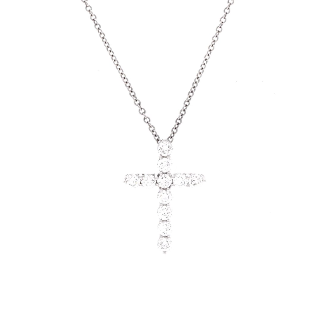 Small Platinum Cross Pendant Necklace by Tiffany Co.: Small Platinum Cross Pendant Necklace by Tiffany Co. Small Platinum Cross Pendant Necklace by Tiffany Co. features a stunning diamond-studded platinum cross pendant, suspended from a sleek silver