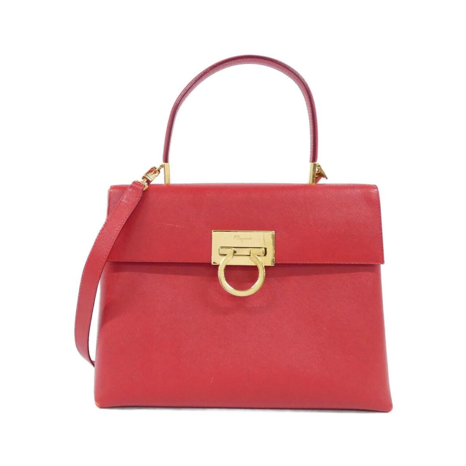 Salvatore Ferragamo Handbag Leather: Salvatore Ferragamo Handbag Leather This Salvatore Ferragamo handbag features rich red leather and a sturdy shoulder strap, making it a stylish and practical accessory for women. The bag's compact siz
