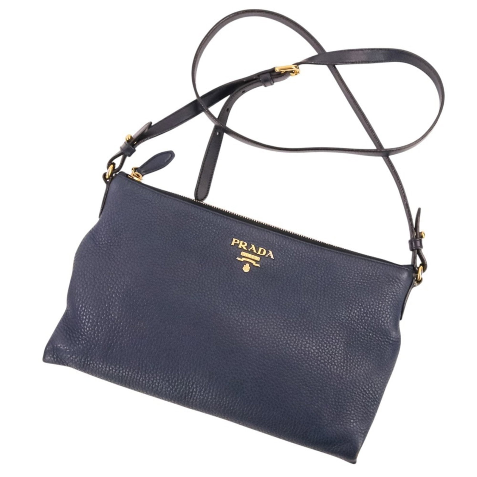 Shoulder Bag Leather by Prada: Shoulder Bag Leather by Prada Navy leather shoulder bag from Prada, featuring a classic design with clean lines and a spacious interior. This stylish bag measures 18cm x 29cm x 5cm and comes with adju