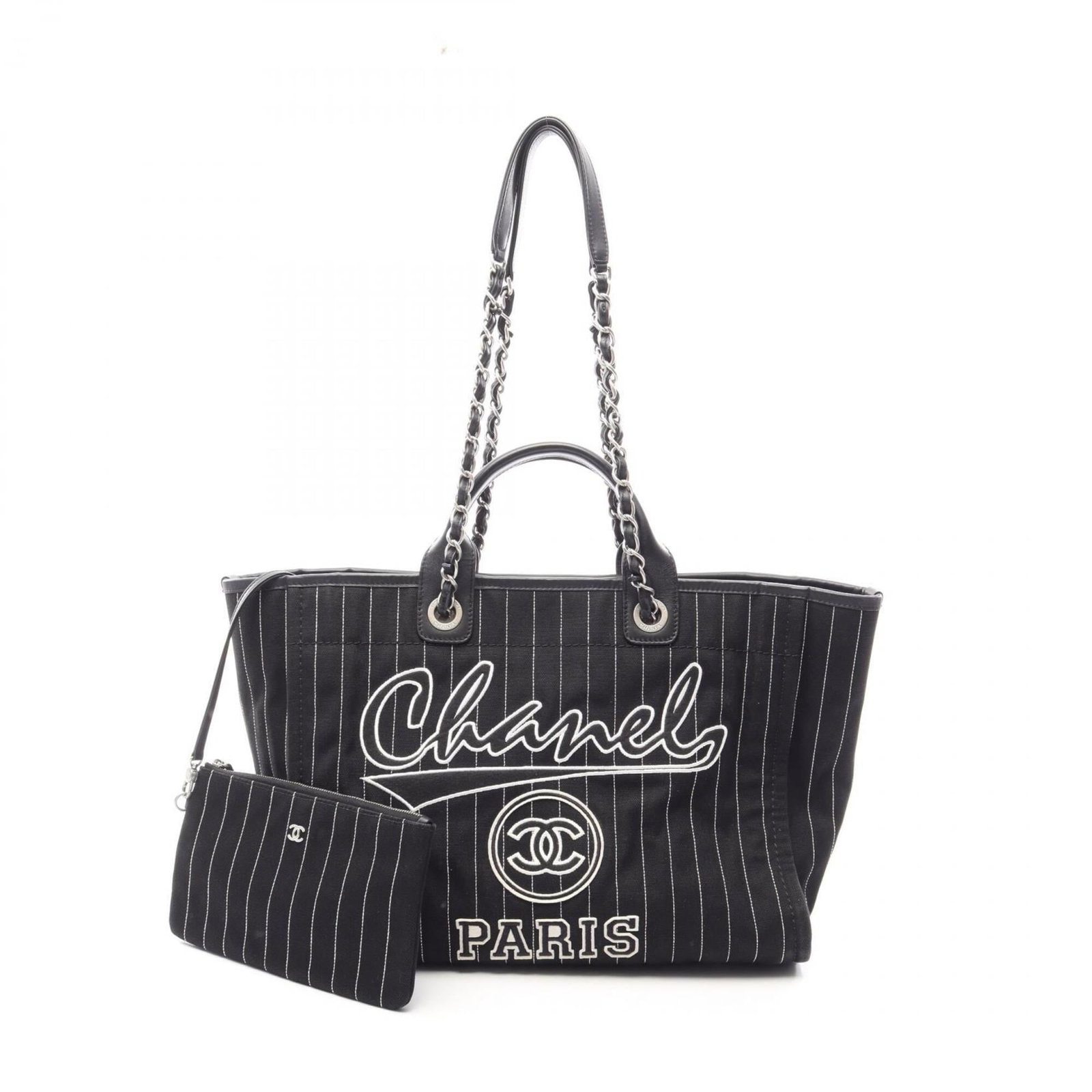 Handbag Canvas Leather Pouch Tote Chanel: Handbag Canvas Leather Pouch Tote Chanel Canvas and leather combine in sleek, modern design. This black Chanel tote features silver hardware and measures 29cm x 38cm x 19cm. A stylish accessory for ev