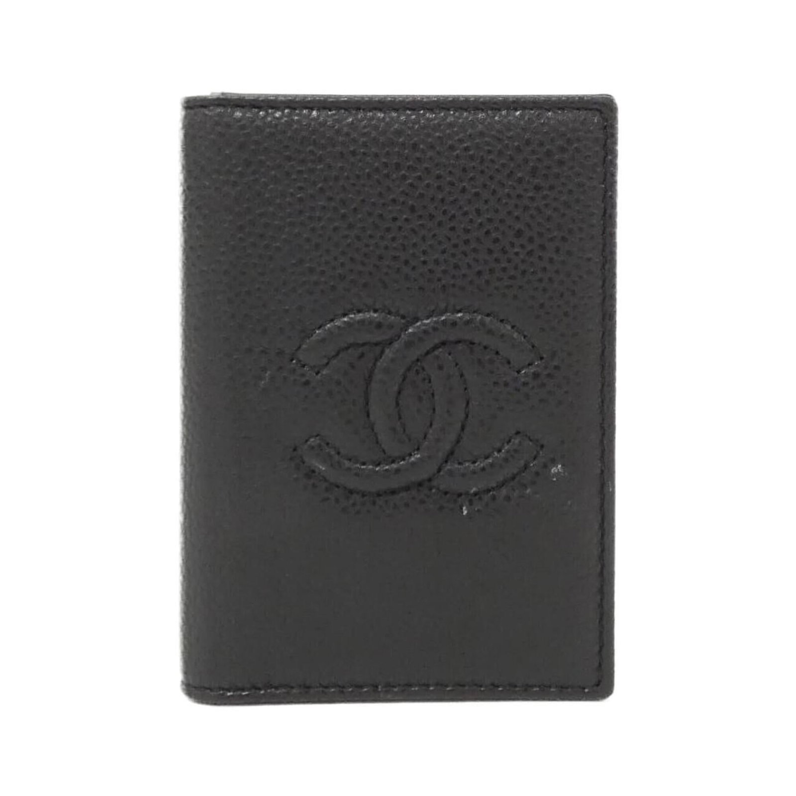 Calfskin card case by Chanel: Calfskin card case by Chanel This black calfskin card case from Chanel features a sleek and sophisticated design, with a subtle grain texture adding depth to its luxurious feel. Measuring 11cm x 8cm x