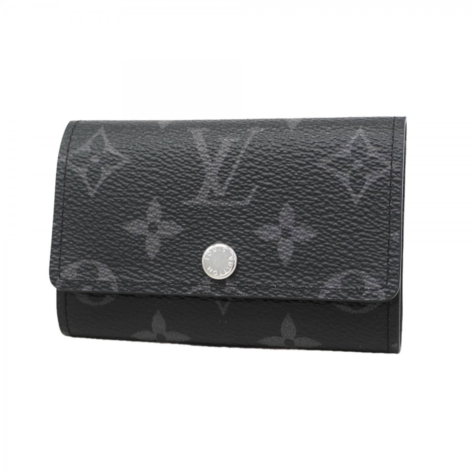 Keycase by Louis Vuitton: Keycase by Louis Vuitton This sleek Louis Vuitton keycase boasts a classic black design, perfectly sized for everyday use. Measuring just 7cm x 10.5cm x 1.5cm, it's compact and convenient to carry. It
