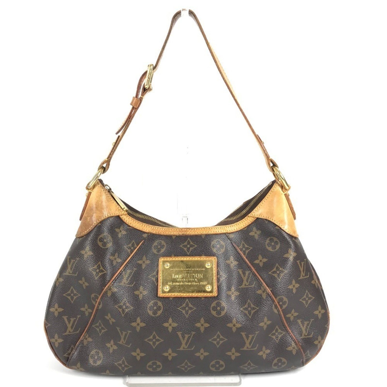Shoulder Bag Monogram Canvas by Louis Vuitton: Shoulder Bag Monogram Canvas by Louis Vuitton The Louis Vuitton Shoulder Bag Monogram Canvas boasts a timeless design, featuring the iconic monogram pattern in rich brown tones. Crafted from high-qual