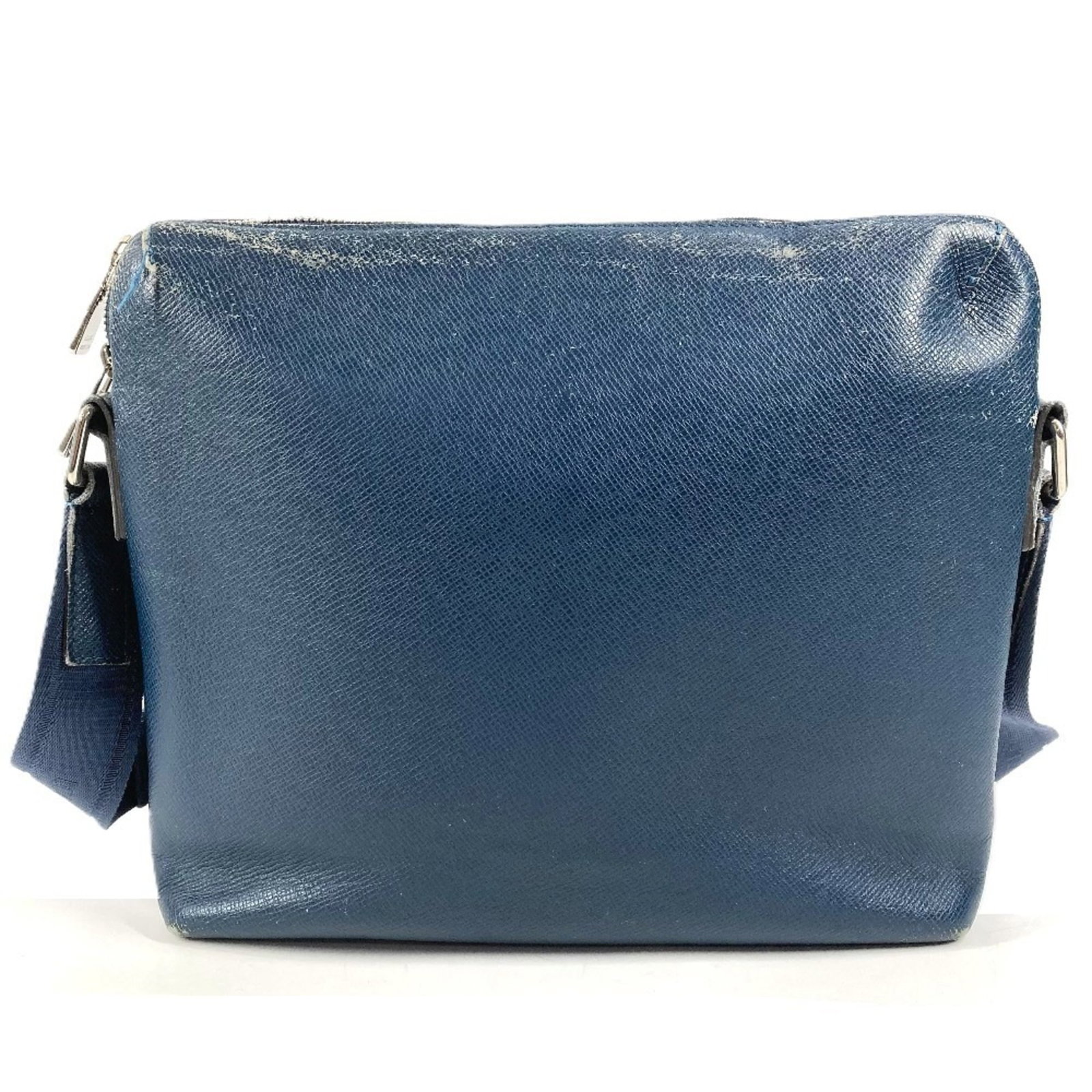 Taiga Leather Shoulder Bag by Louis Vuitton: Taiga Leather Shoulder Bag by Louis Vuitton Taiga Leather Shoulder Bag by Louis Vuitton. Made from high-quality Taiga leather, this shoulder bag features a classic design with a blue color that adds a