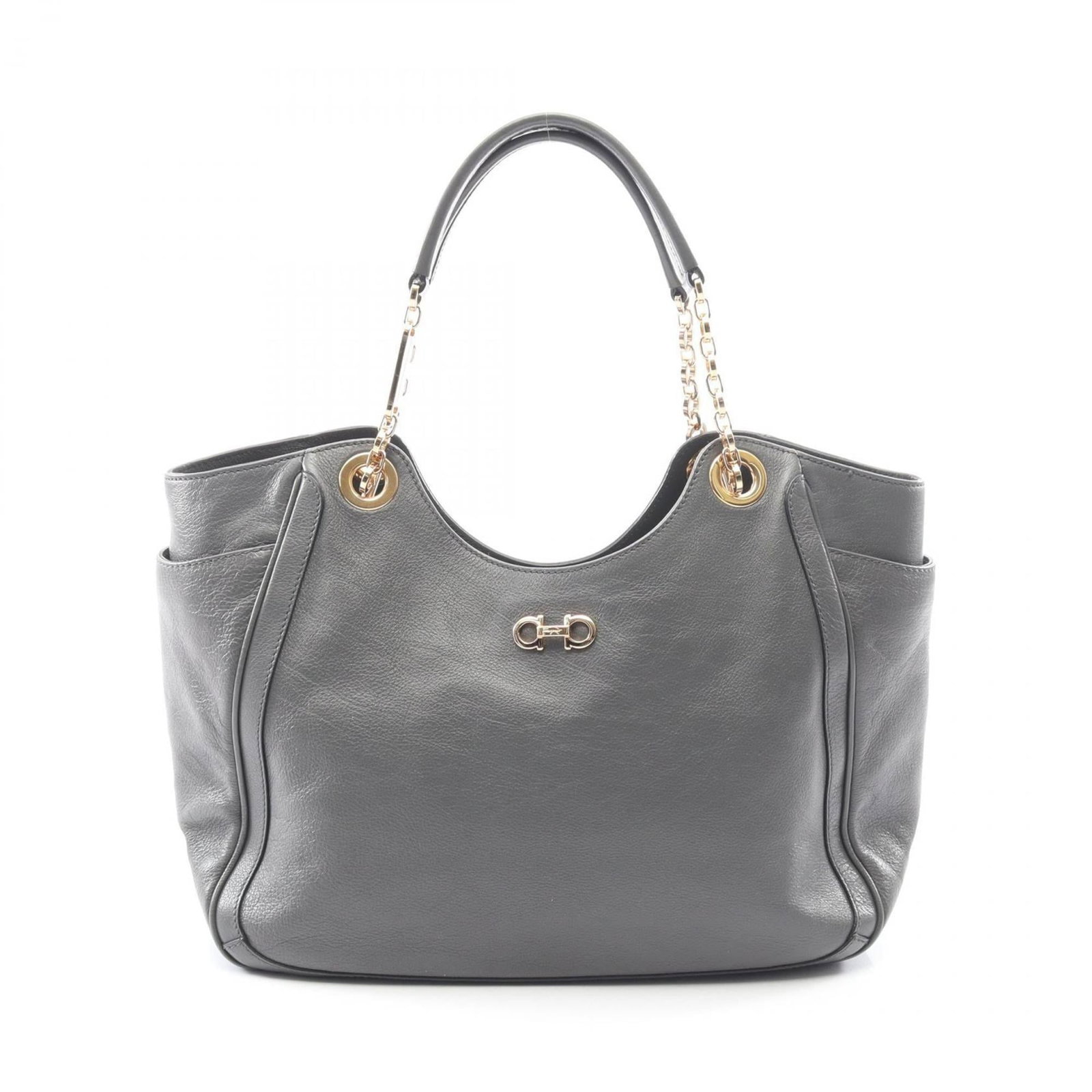 Ferragamo Salvatore Handbag Leather Tote: Ferragamo Salvatore Handbag Leather Tote The Salvatore Ferragamo Leather Tote is a stylish and sophisticated handbag made from high-quality leather, featuring a classic gray color. Measuring 20cm x 32
