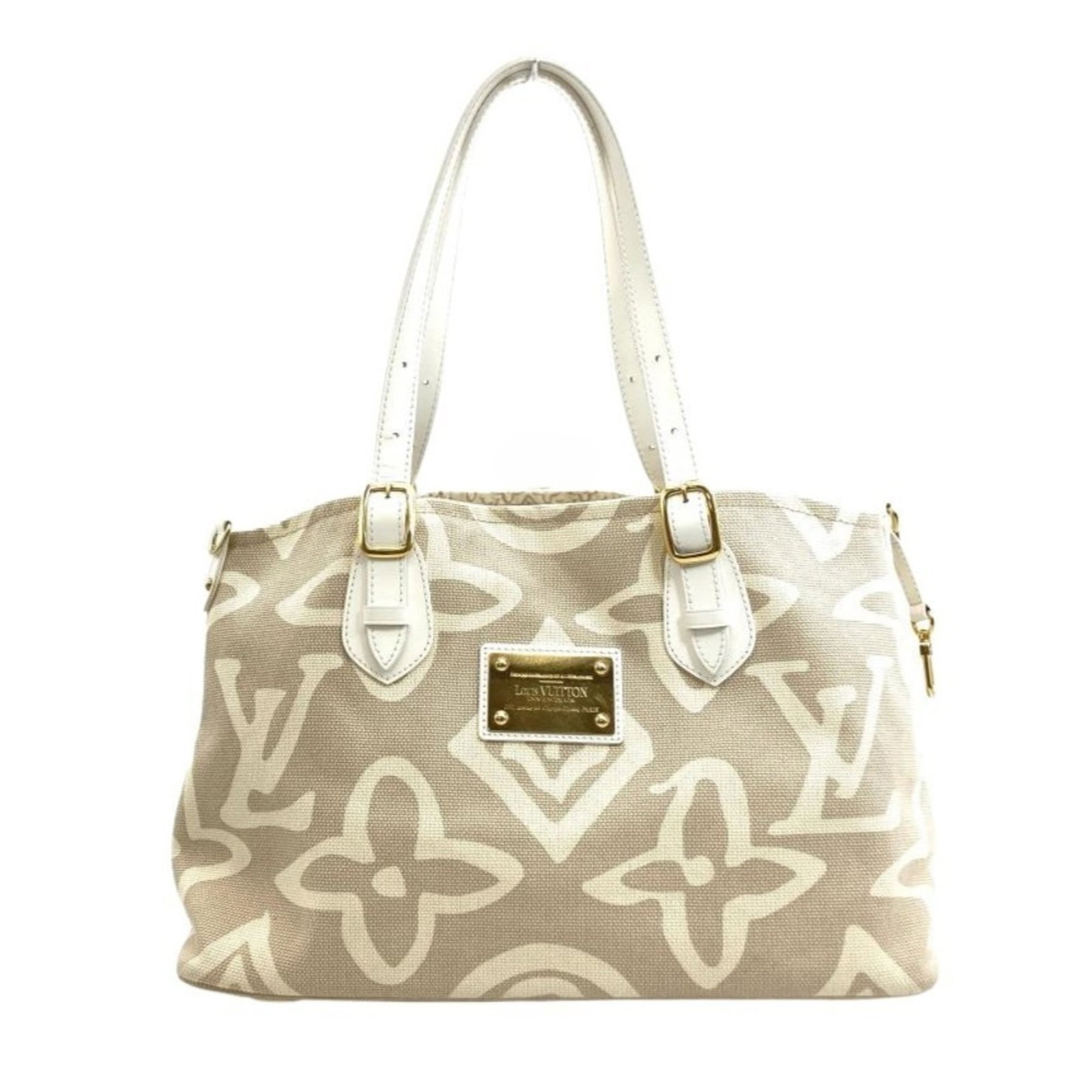Canvas tote bag by Louis Vuitton: Canvas tote bag by Louis Vuitton Canvas tote bag by Louis Vuitton, featuring iconic sable color and gold hardware. Made from high-quality canvas material, this stylish tote measures 26cm x 41cm x 16.5