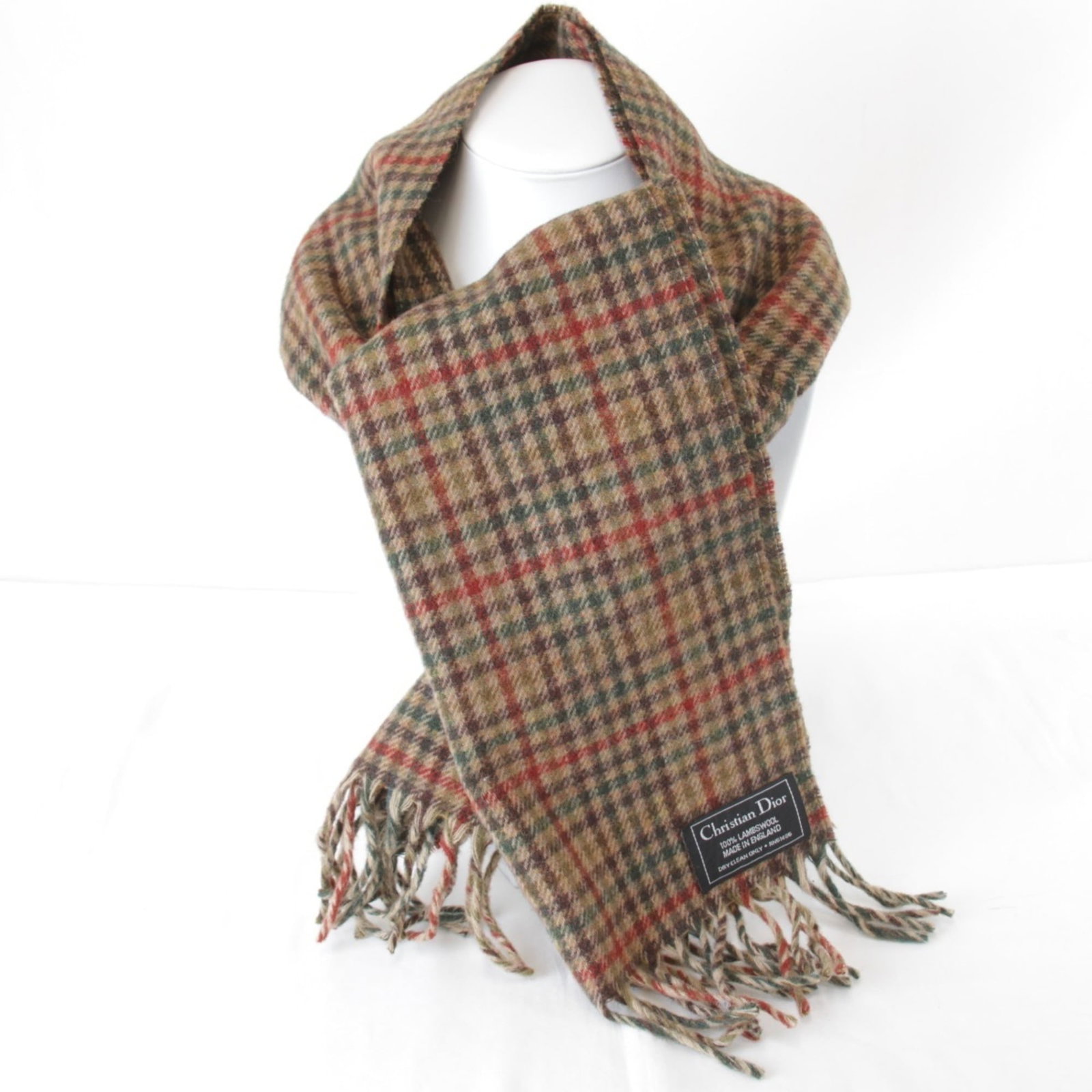 Stole by Christian Dior from Wool: Stole by Christian Dior from Wool Stole by Christian Dior, crafted from luxurious wool, boasts a rich brown hue and elegant dimensions of 1.34m x 31cm. This statement piece showcases the iconic