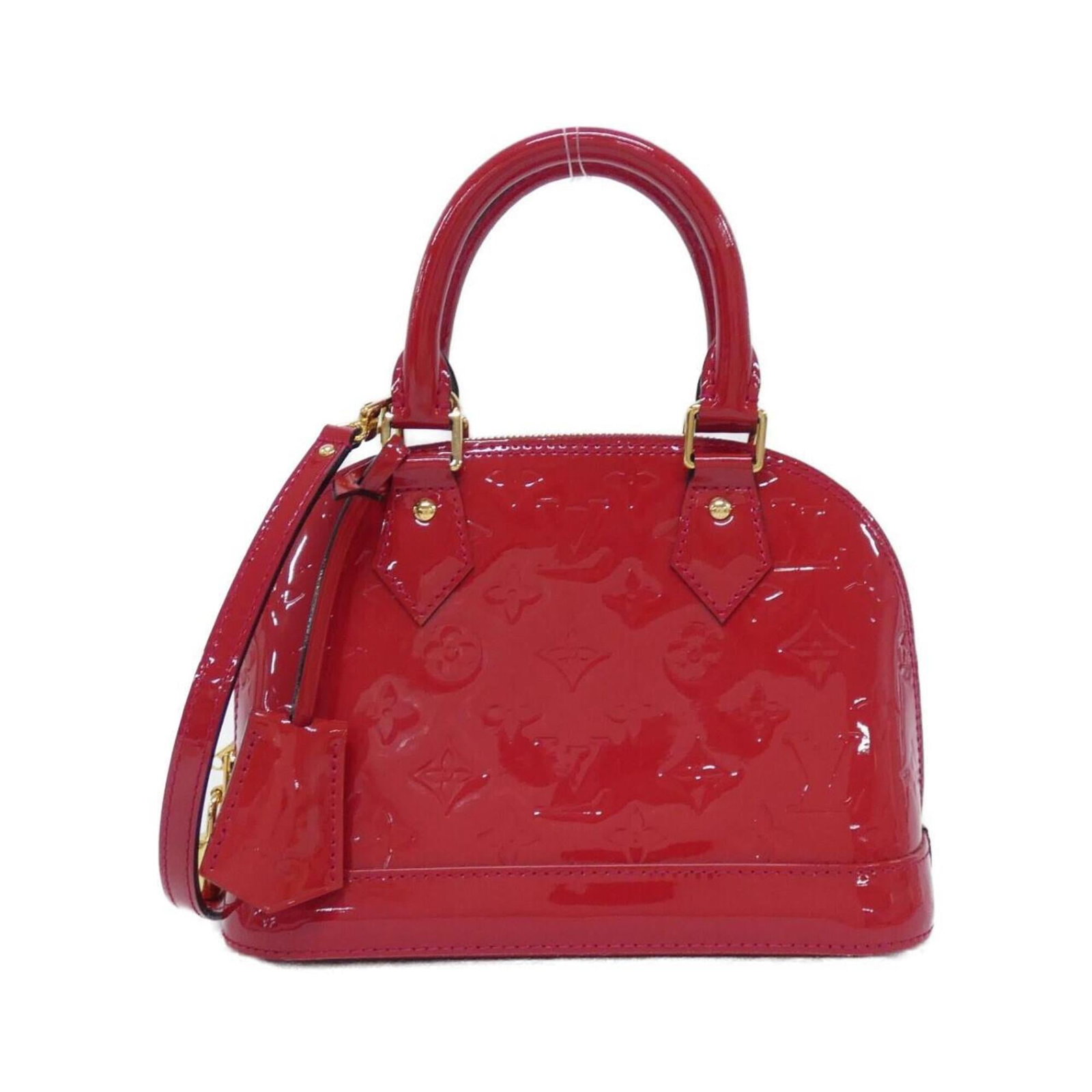 Louis Vuitton Handbag Leather: Louis Vuitton Handbag Leather Cerise red leather handbag from Louis Vuitton, featuring an enamel finish and measuring 19cm x 25cm x 11cm. This stylish accessory boasts a classic design with a