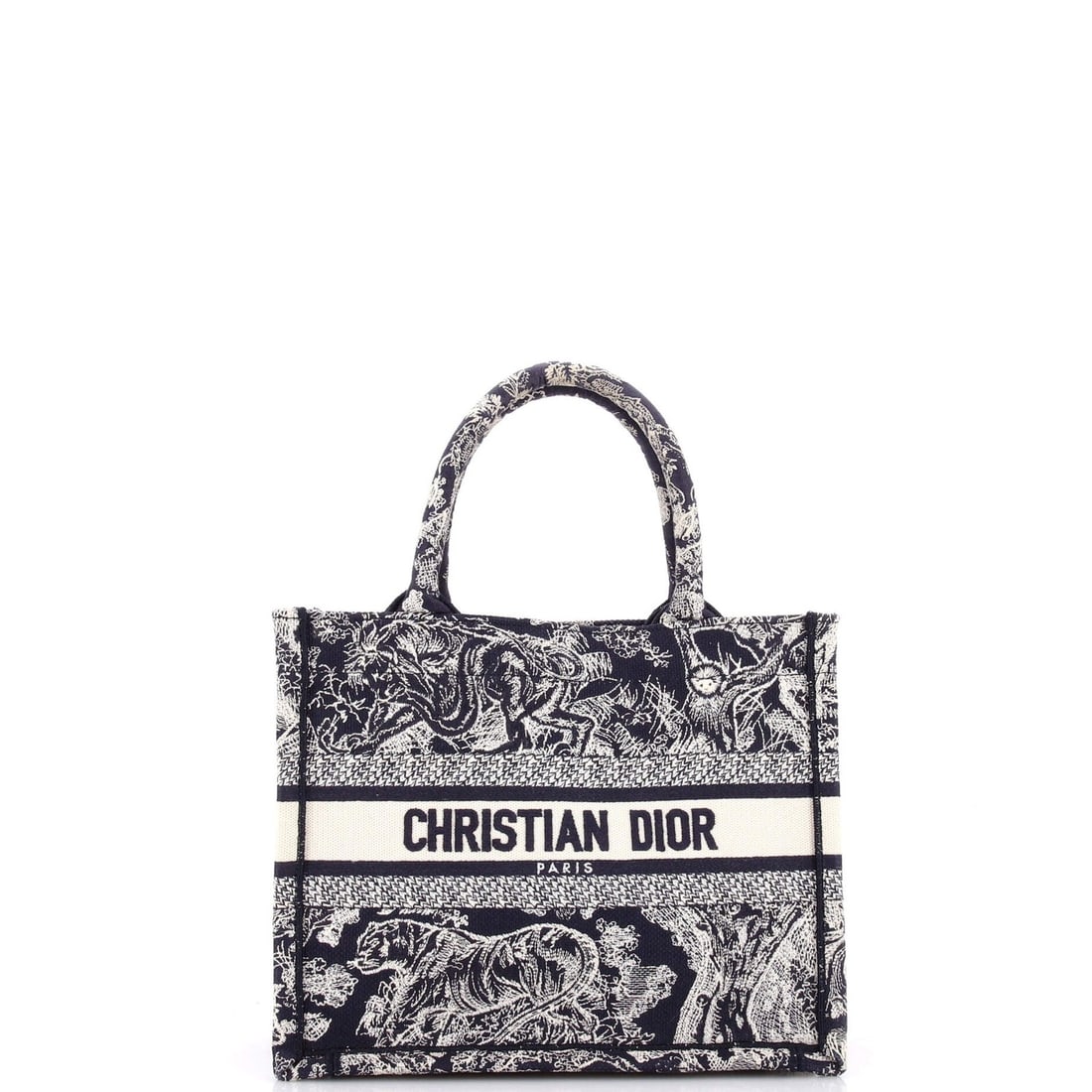 Christian Dior Small Embroidered Canvas Book Tote: Christian Dior Small Embroidered Canvas Book Tote Small Blue Embroidered Canvas Book Tote from Christian Dior, featuring a plain canvas exterior with blue color and embroidered design. This small