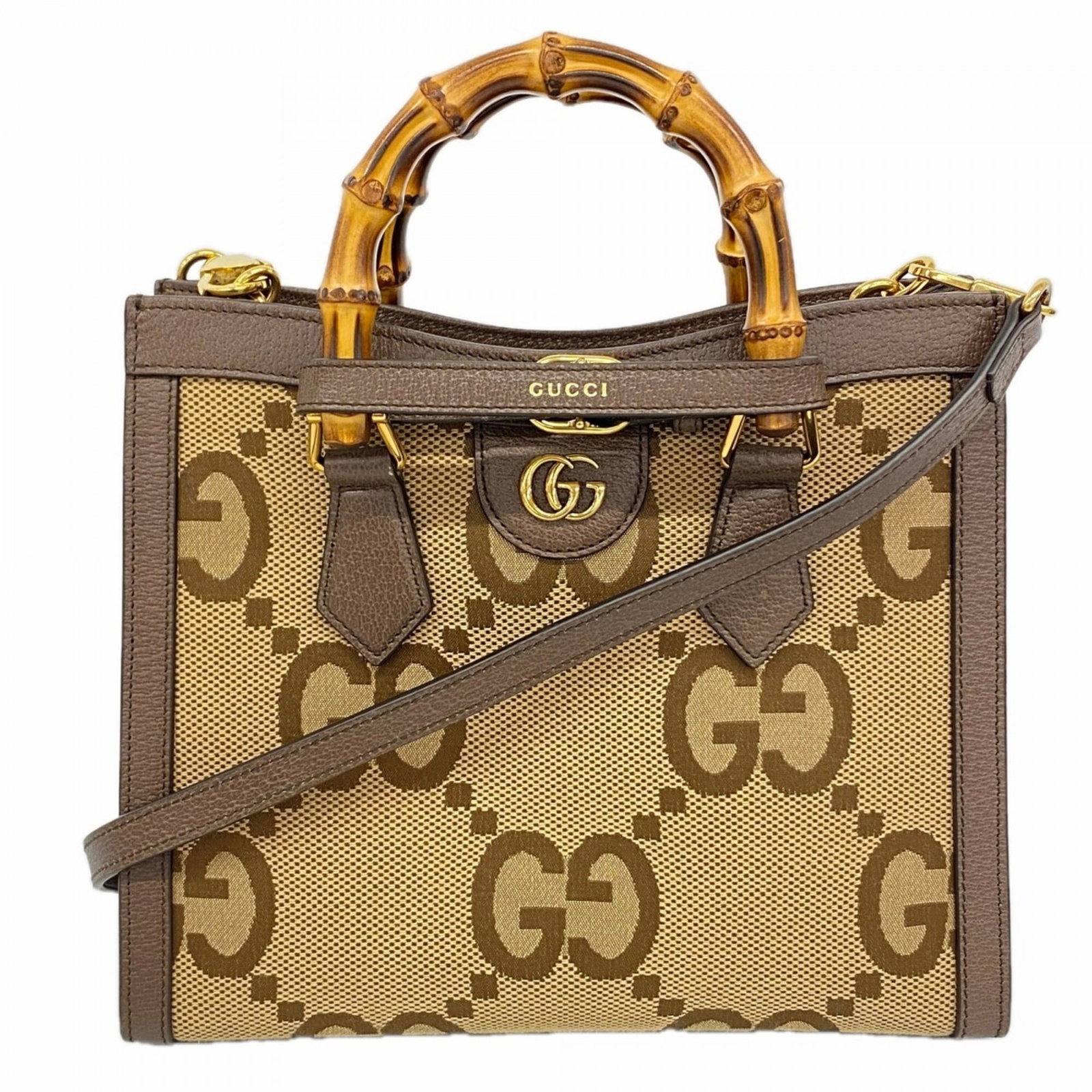 Handbag Canvas Leather Gucci: Handbag Canvas Leather Gucci Canvas and leather blend in this Gucci handbag, available in brown color with gold hardware. The bag measures 23cm x 27cm x 11cm and features a classic design. A