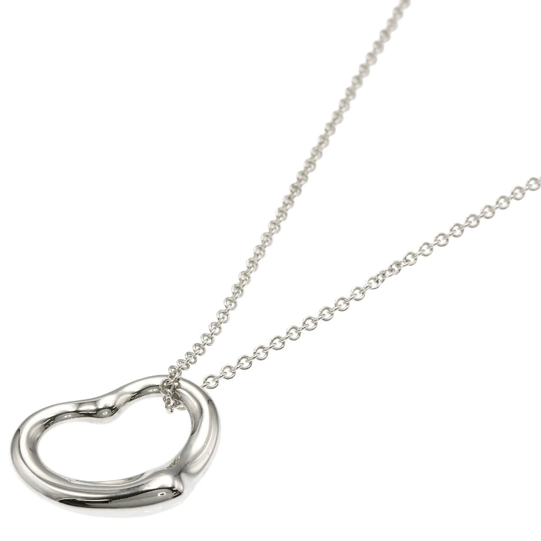 Tiffany Co Open Heart Silver Necklace: Tiffany Co Open Heart Silver Necklace The Tiffany Co Open Heart Silver Necklace boasts an elegant design with its silver metal exterior, measuring 15.7 inches in length. This sterling silver necklace