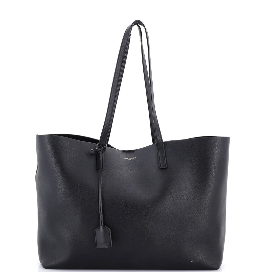 Leather tote shopper from Saint Laurent: Leather tote shopper from Saint Laurent Black Saint Laurent leather tote shopper with gold hardware, featuring a large exterior and raw leather interior. The bag boasts a classic style with a