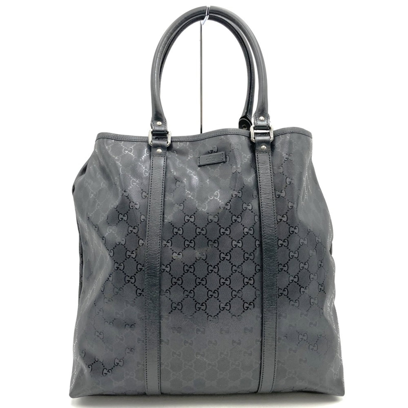 Gucci Tote Bag Gg Imprim: Gucci Tote Bag Gg Imprim Gucci's GG Imprim tote bag boasts a sleek black design, showcasing the iconic Gucci logo. Made from high-quality GG Imprim material, this stylish tote measures 34cm x 45cm x 1