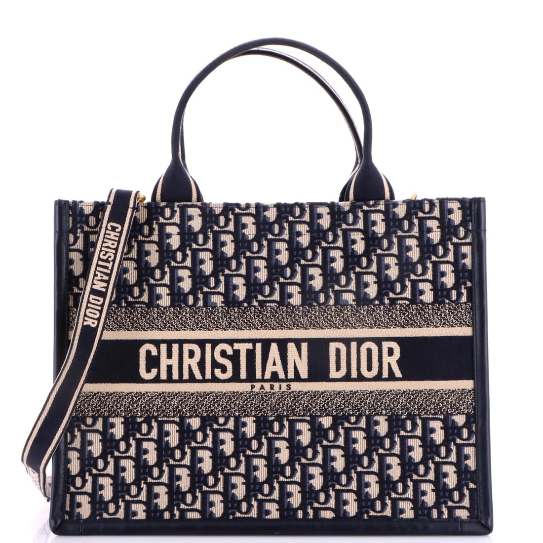 Christian Dior Book Medium Canvas Oblique Tote Strap with: Christian Dior Book Medium Canvas Oblique Tote Strap with The Christian Dior Book Medium Canvas Oblique Tote Strap with Blue exterior and Black interior features a classic design with an oblique shape