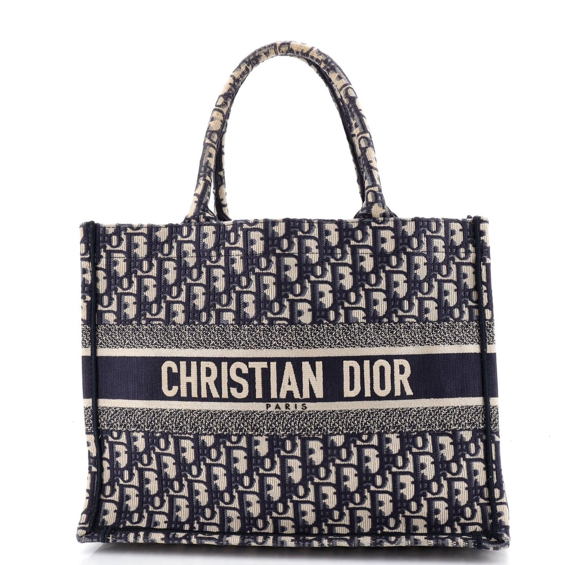 Christian Dior Book Oblique Medium Canvas Tote: Christian Dior Book Oblique Medium Canvas Tote The Christian Dior Book Oblique Medium Canvas Tote boasts a striking blue exterior with minor creases, corner wear, and discoloration. This excellent