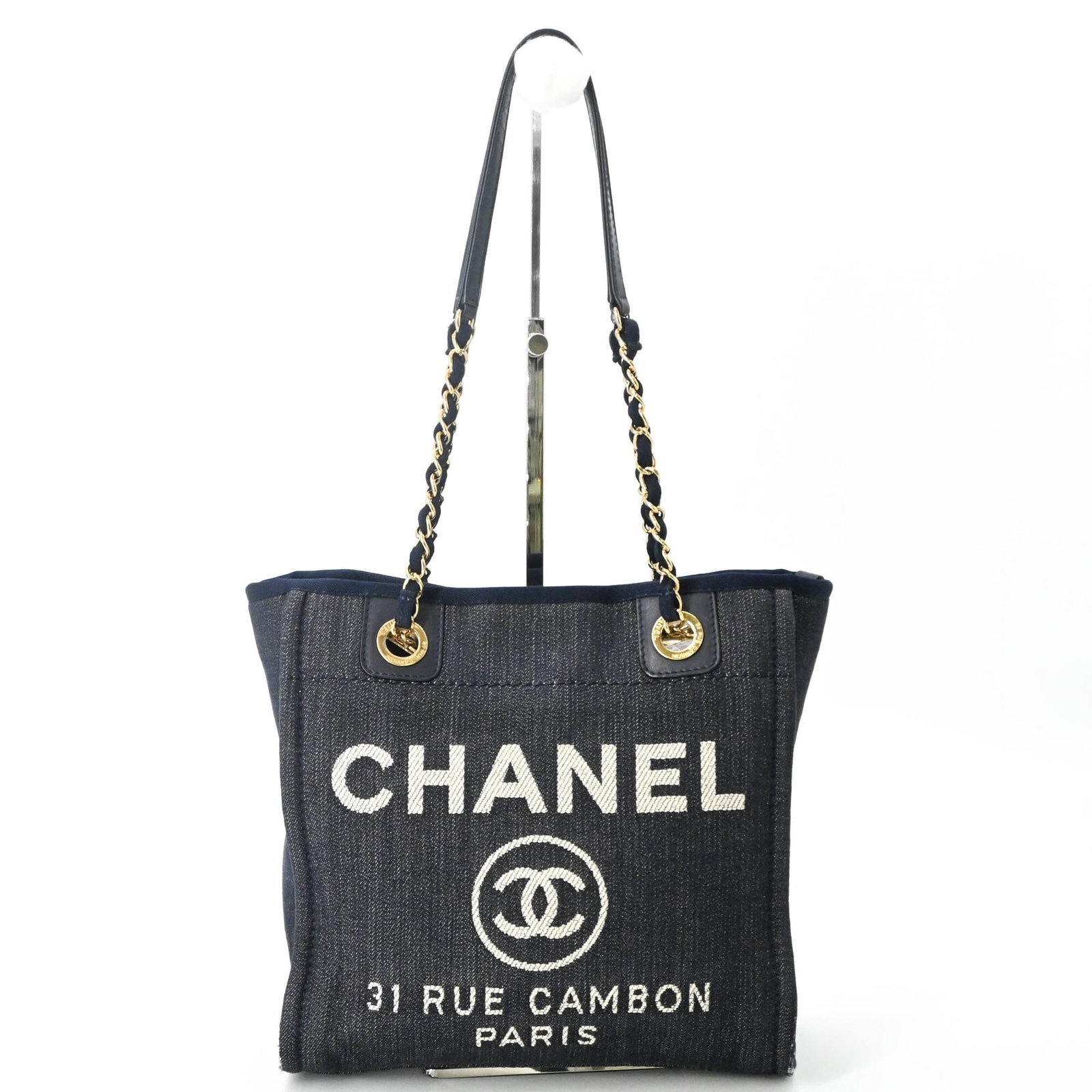 Canvas tote bag by Chanel: Canvas tote bag by Chanel Canvas tote bag by Chanel, made from high-quality canvas material in navy color, features a compact size with dimensions 25cm x 25cm x 6.5cm / 9.84'' x 9.84'' x 2.55''. This 