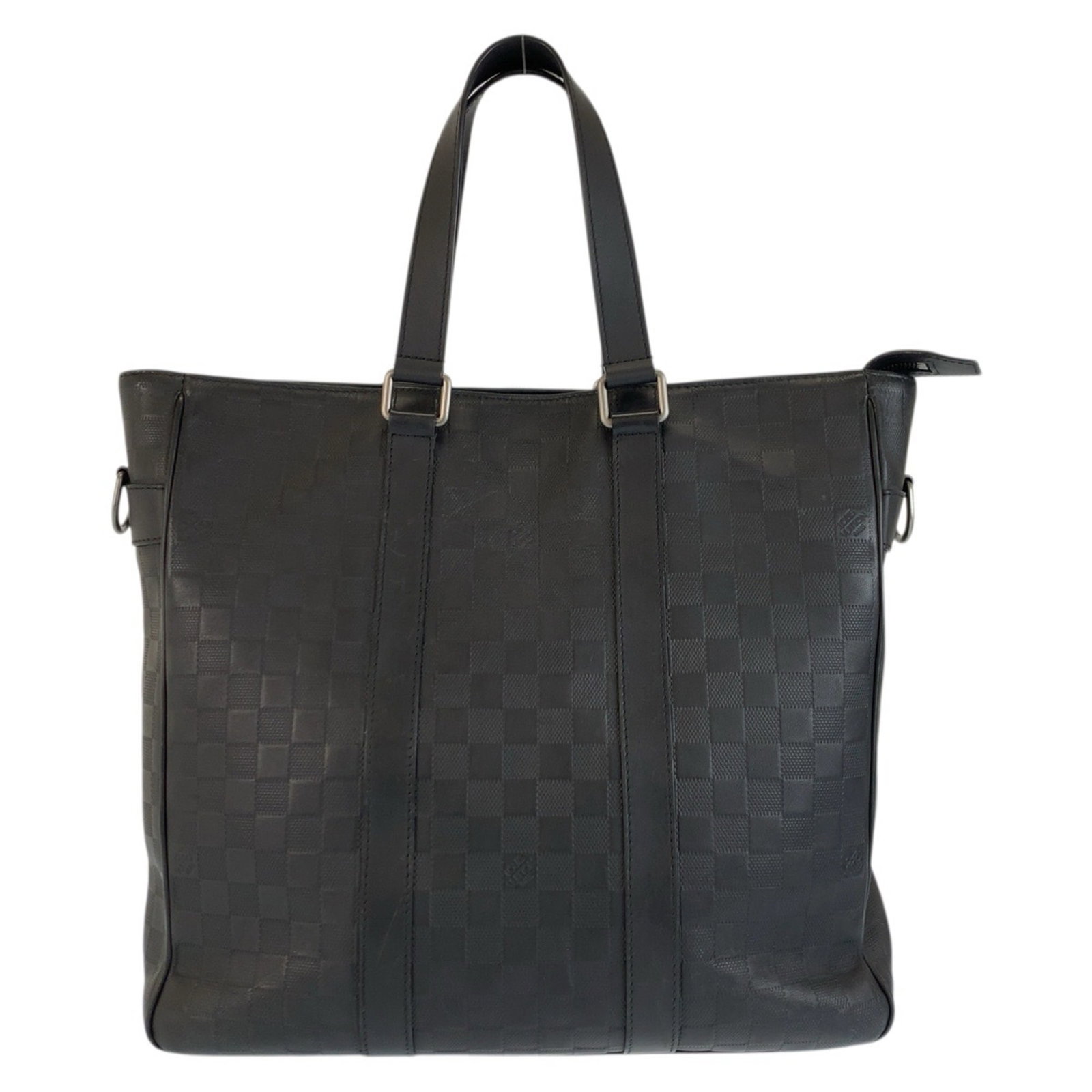 Damier Infini Tote Bag by Louis Vuitton: Damier Infini Tote Bag by Louis Vuitton Damier Infini Tote Bag by Louis Vuitton. The classic Damier Infini pattern, iconic for its unique blend of bold and subtle design elements, is showcased in a
