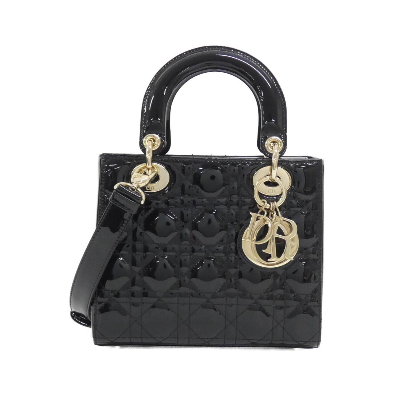 Handbag Christian Dior Leather: Handbag Christian Dior Leather Christian Dior's iconic leather handbag boasts sleek black enamel and premium leather construction, measuring 17cm x 20cm x 8cm. The bag's classic design makes it a