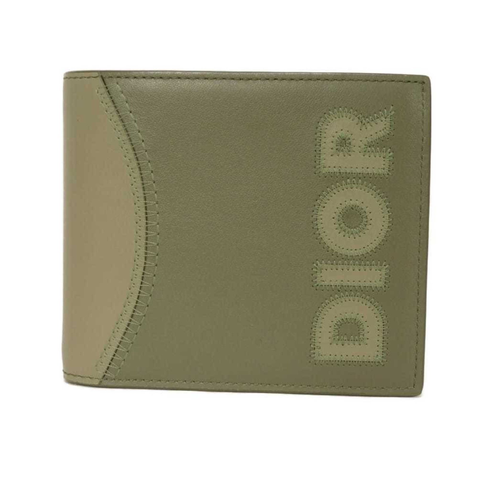 Dior Wallet Bi fold Leather: Dior Wallet Bi fold Leather Christian Dior Wallet Bi fold Leather, crafted from high-quality Calfskin leather in a classic Khaki color. This bi-fold wallet features multiple compartments for organizat