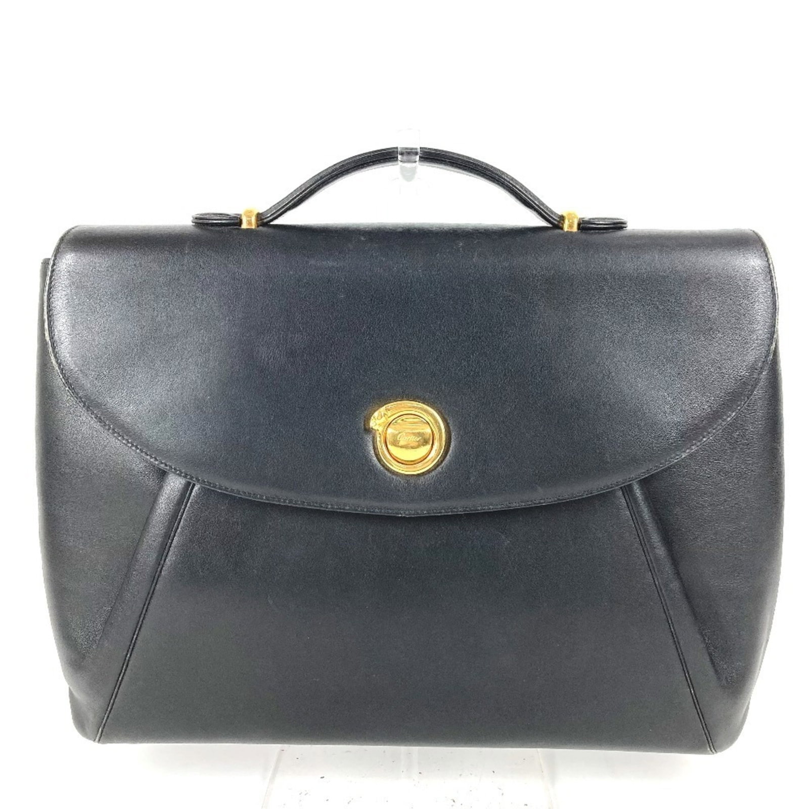 Cartier Handbag Tote Bag Leather: Cartier Handbag Tote Bag Leather Cartier's sleek and sophisticated tote bag boasts a striking black leather exterior, adorned with elegant gold hardware. The panthre design adds a touch of timeless