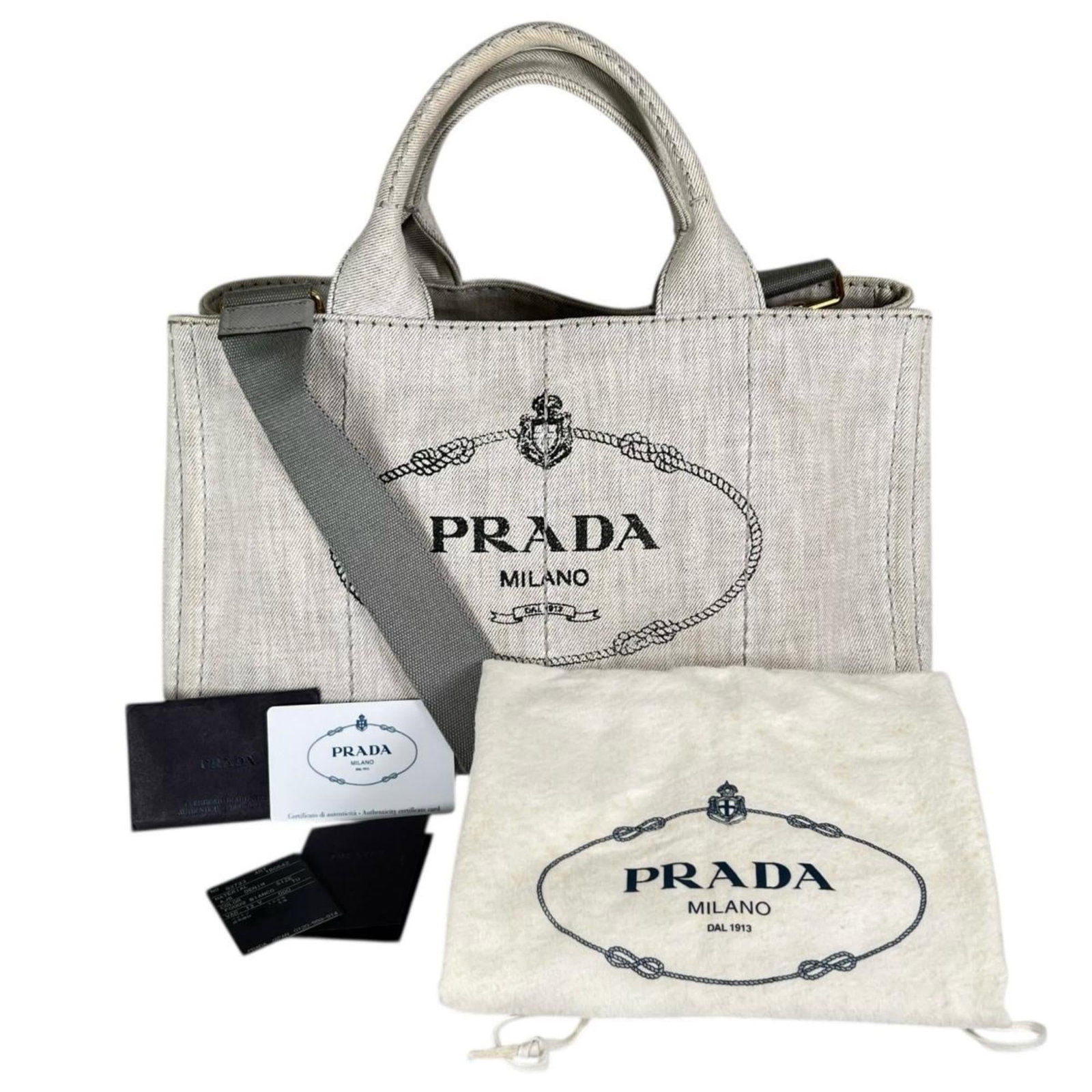Denim Tote Bag Prada: Denim Tote Bag Prada Denim Tote Bag by Prada, crafted from high-quality denim with a classic design. This versatile tote bag features a durable dust bag and comes with a guarantee card for added peace